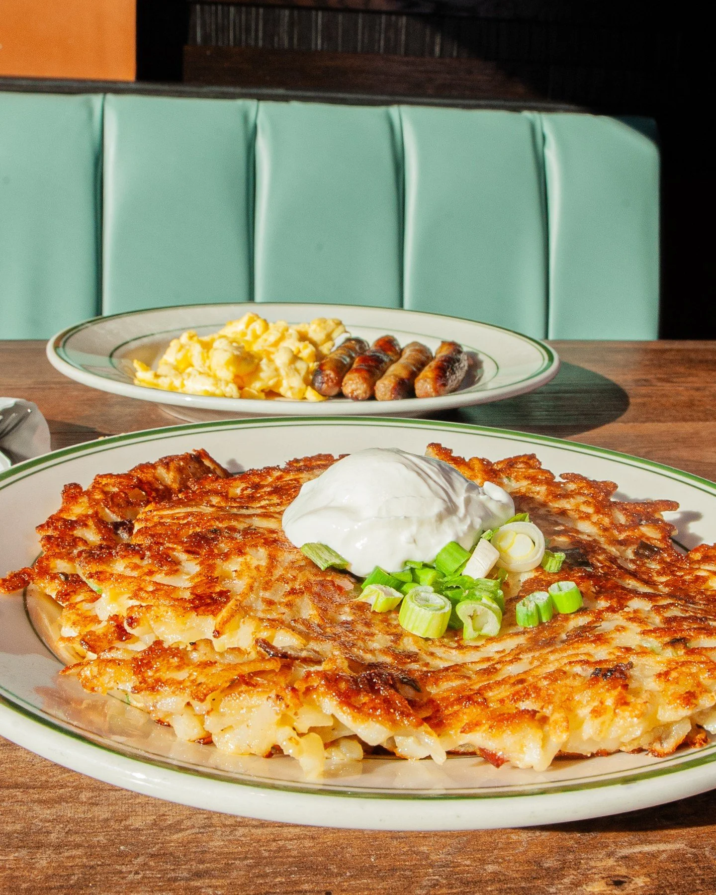 Have you tried our Idaho Potato Pancakes? They are a fan fave!⁠
⁠
A blend of hash browns, chopped bacon, green onions and cheddar cheese topped with a dollop of sour cream. Grab the full breakfast, served with two eggs cooked any style and your choic