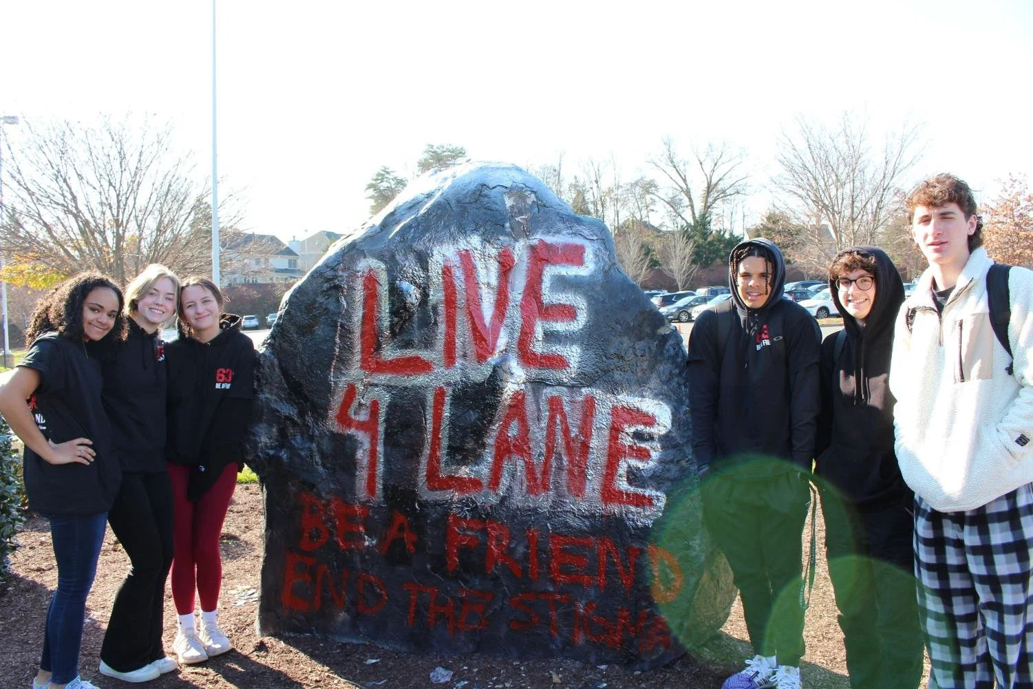  The organizers of the Live4Lane club, as well as Lane’s closest friends, met after the moment of silence. (Caelan Jones) 