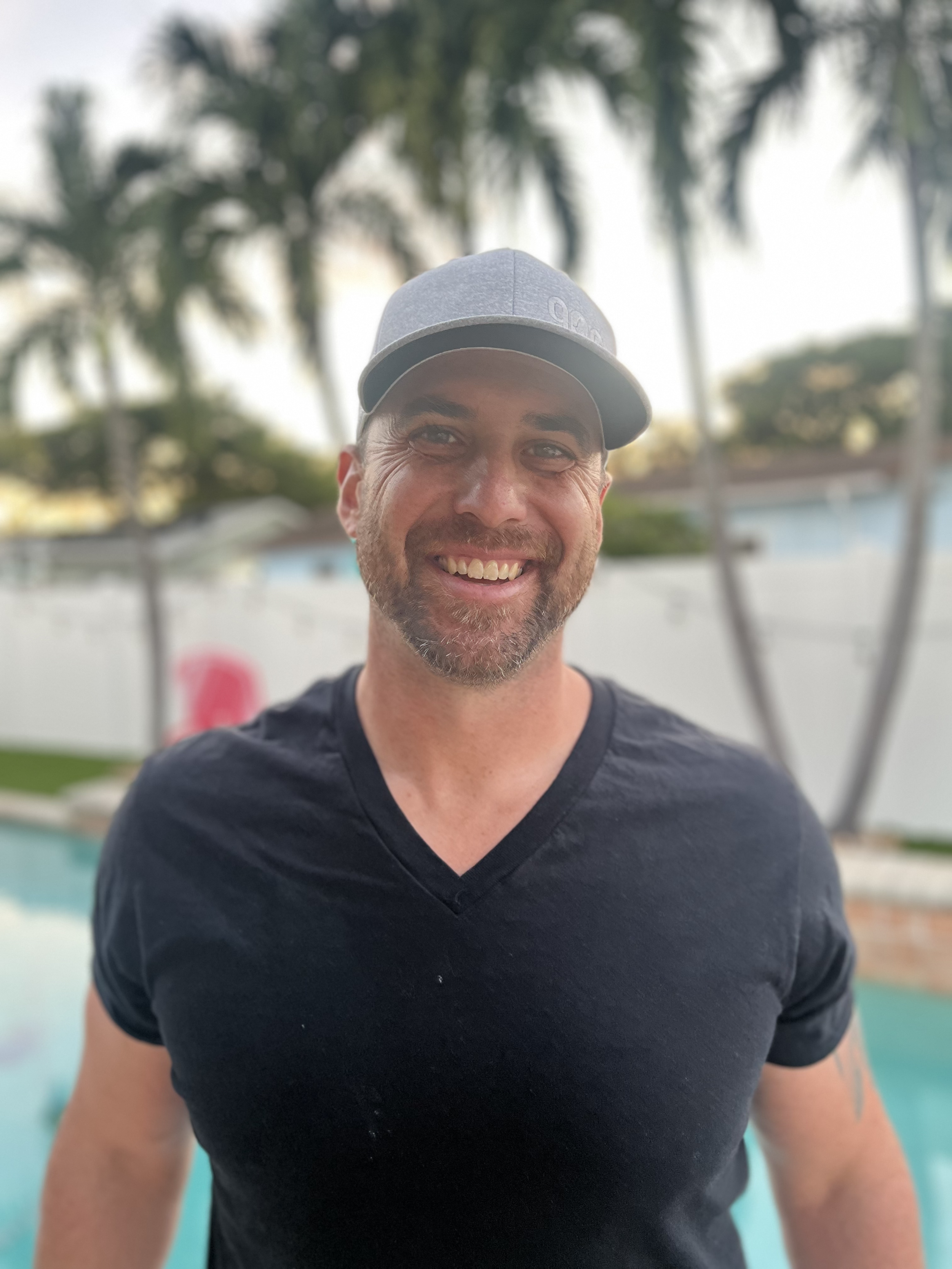 A grayscale vector illustration of a man wearing a suit and tie, with no facial features.