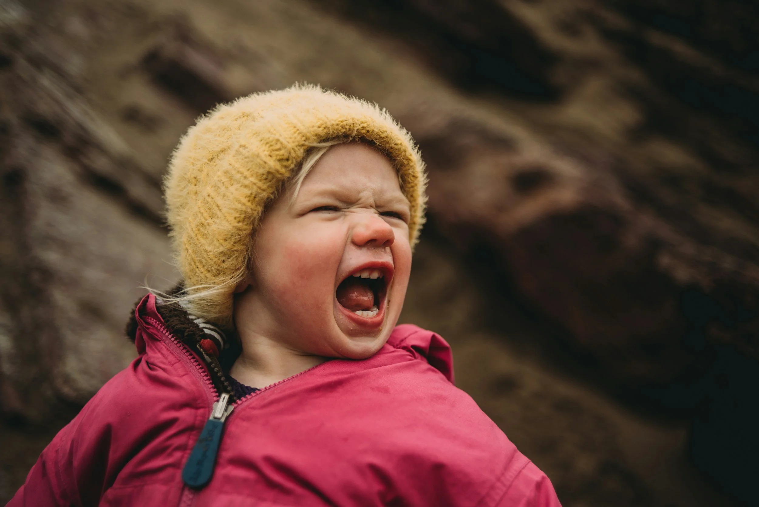 an angry child screams