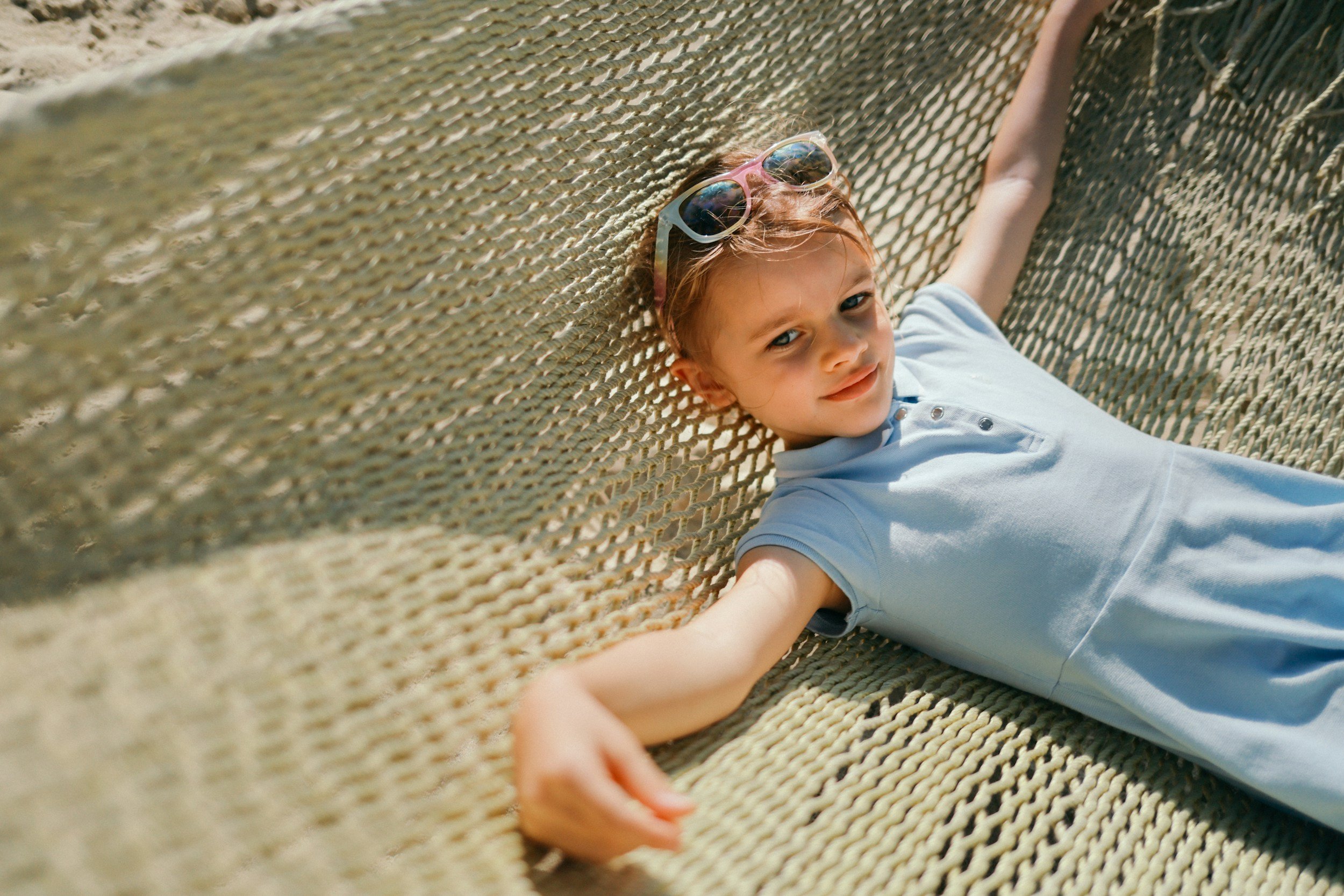 a child swings in a hammock