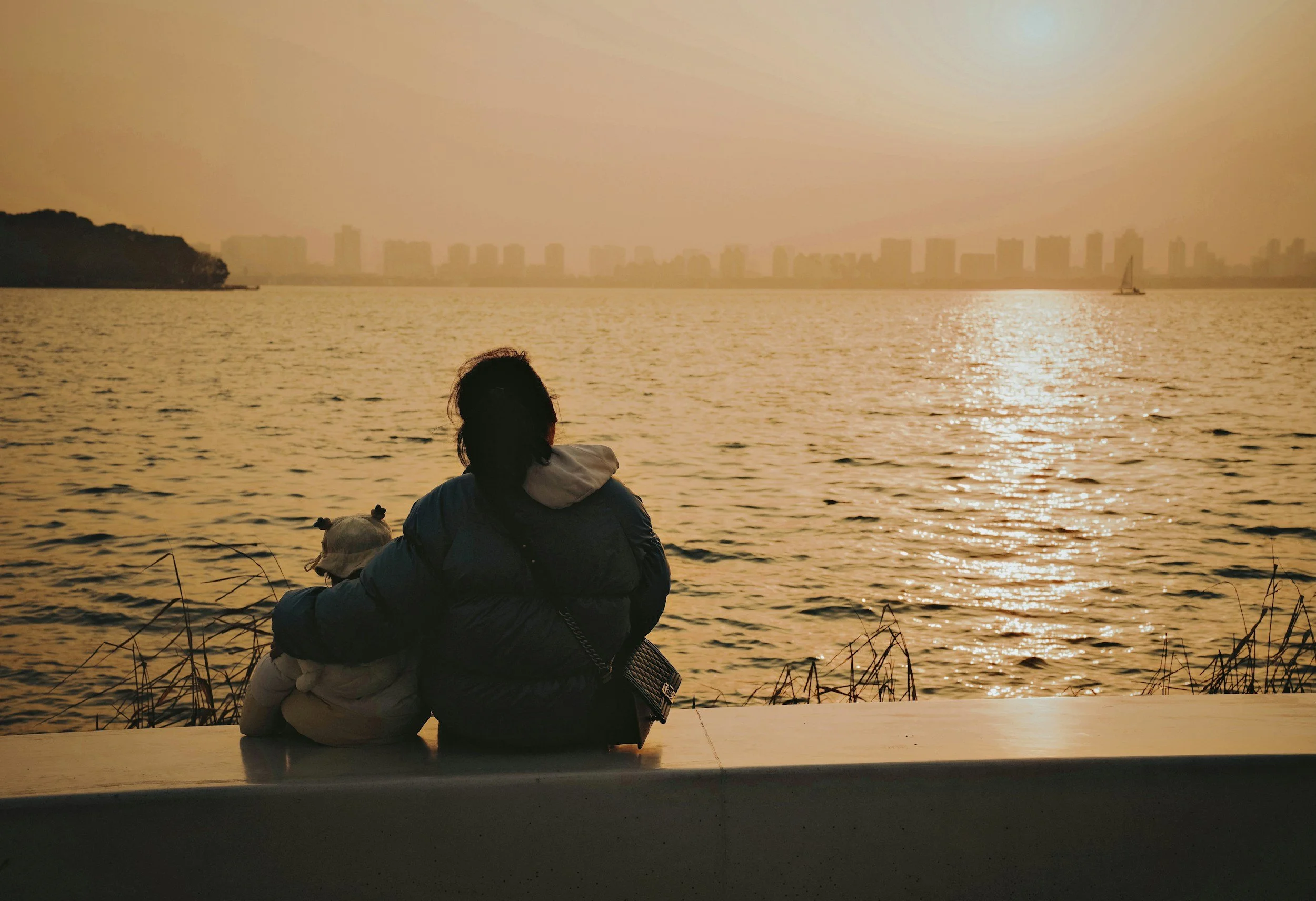 a parent comforts their child