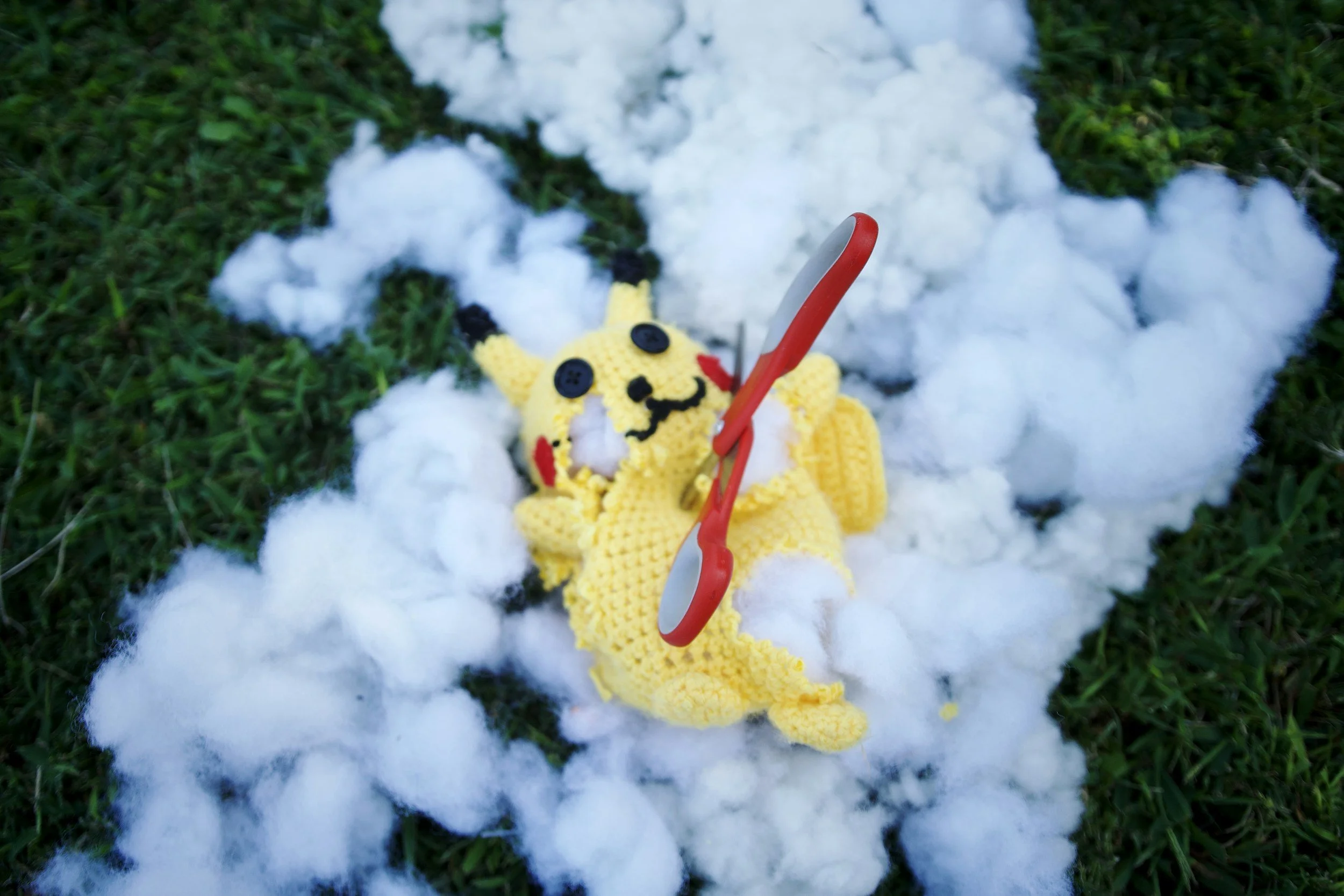 a broken toy with scissors in it