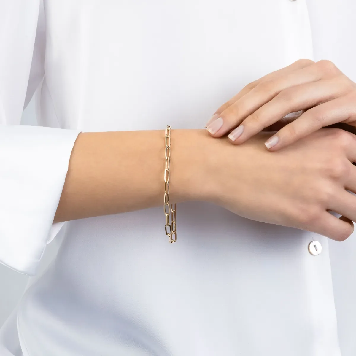 Luxe Sparkles LS-A002: 14kt yellow gold paperclip bracelet, worn on the wrist