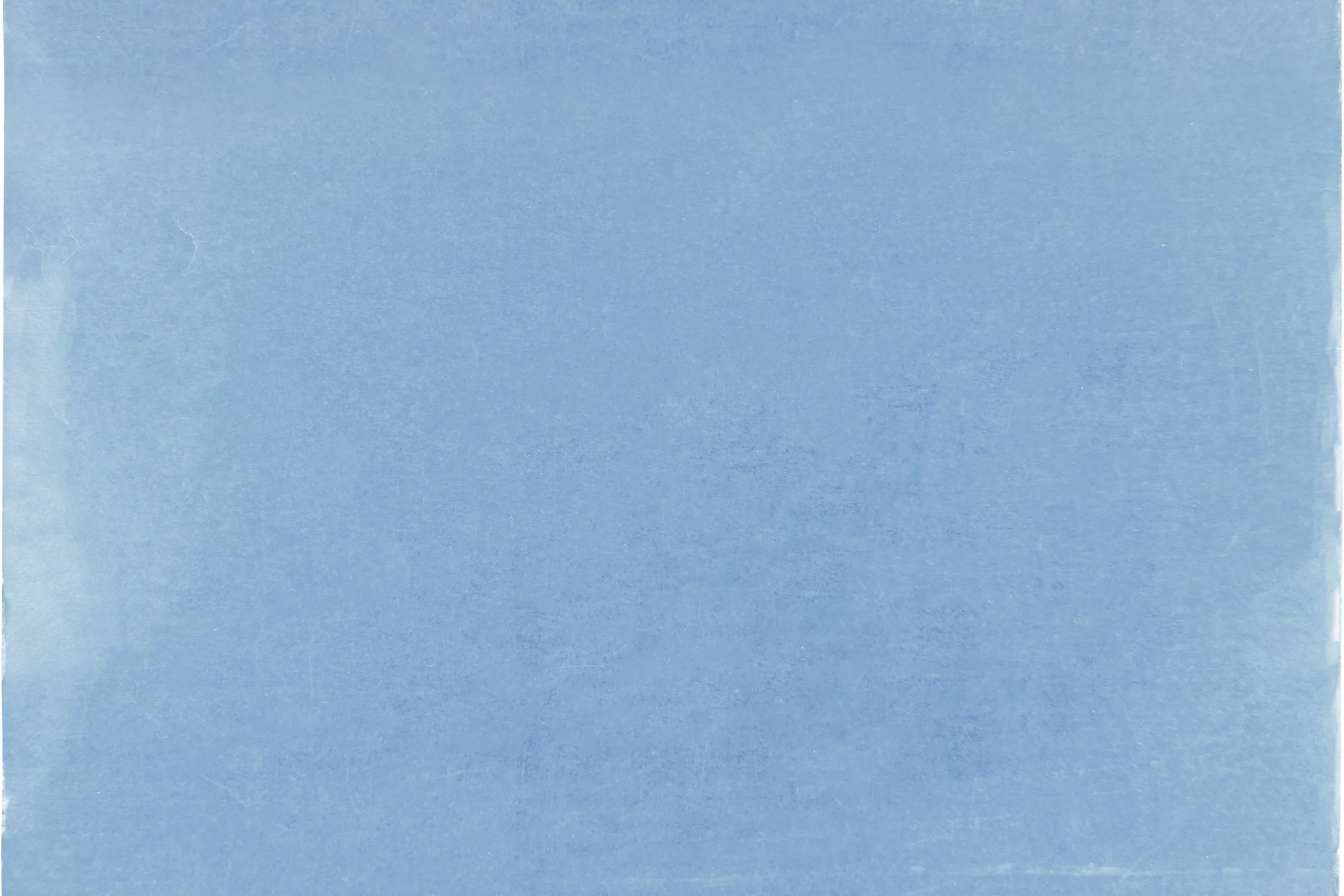 A blank blue sheet of paper with a slightly textured surface.
