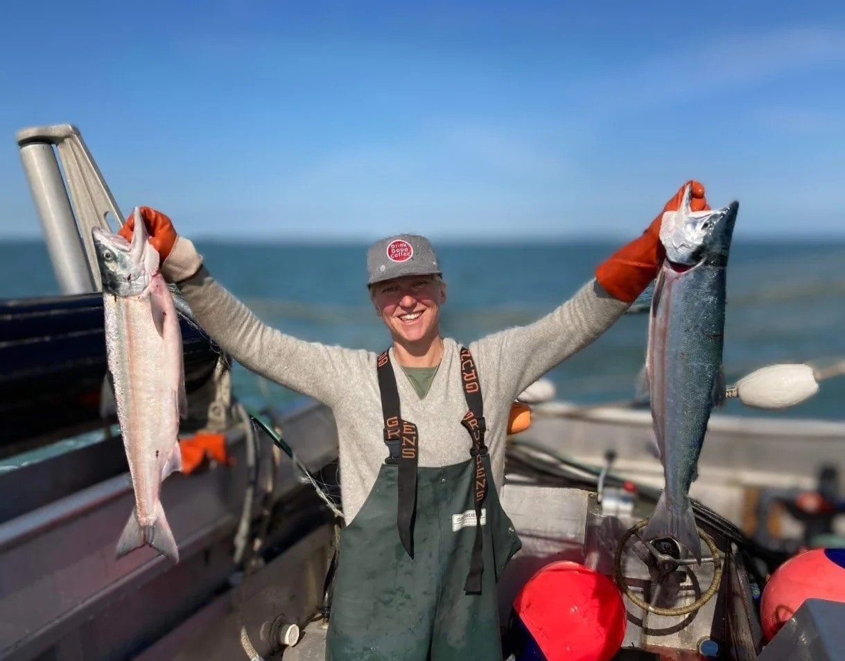  Christa Miller-Shelley, a veteran of years sailing in the Rockland schooner fleet, holding two fish.  