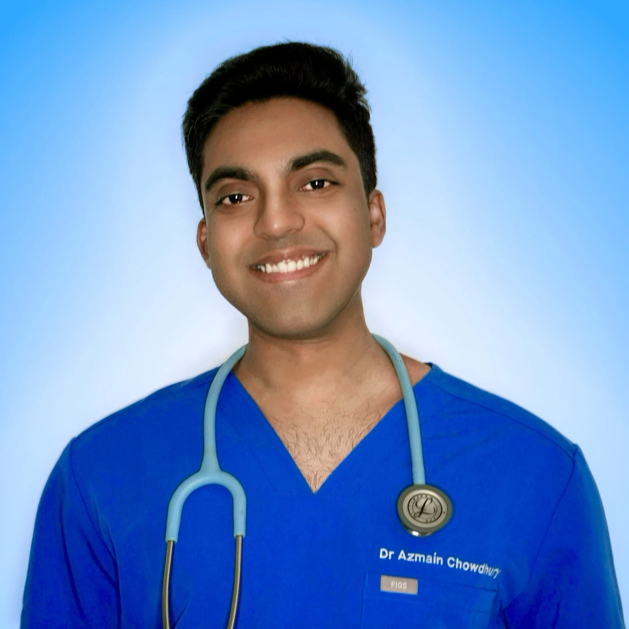 Dr Azmain Chowdhury, a medical doctor and health educator, smiling towards the camera, wearing blue embroidered FIGS-branded scrubs and a light blue Littmann stethoscope around his neck