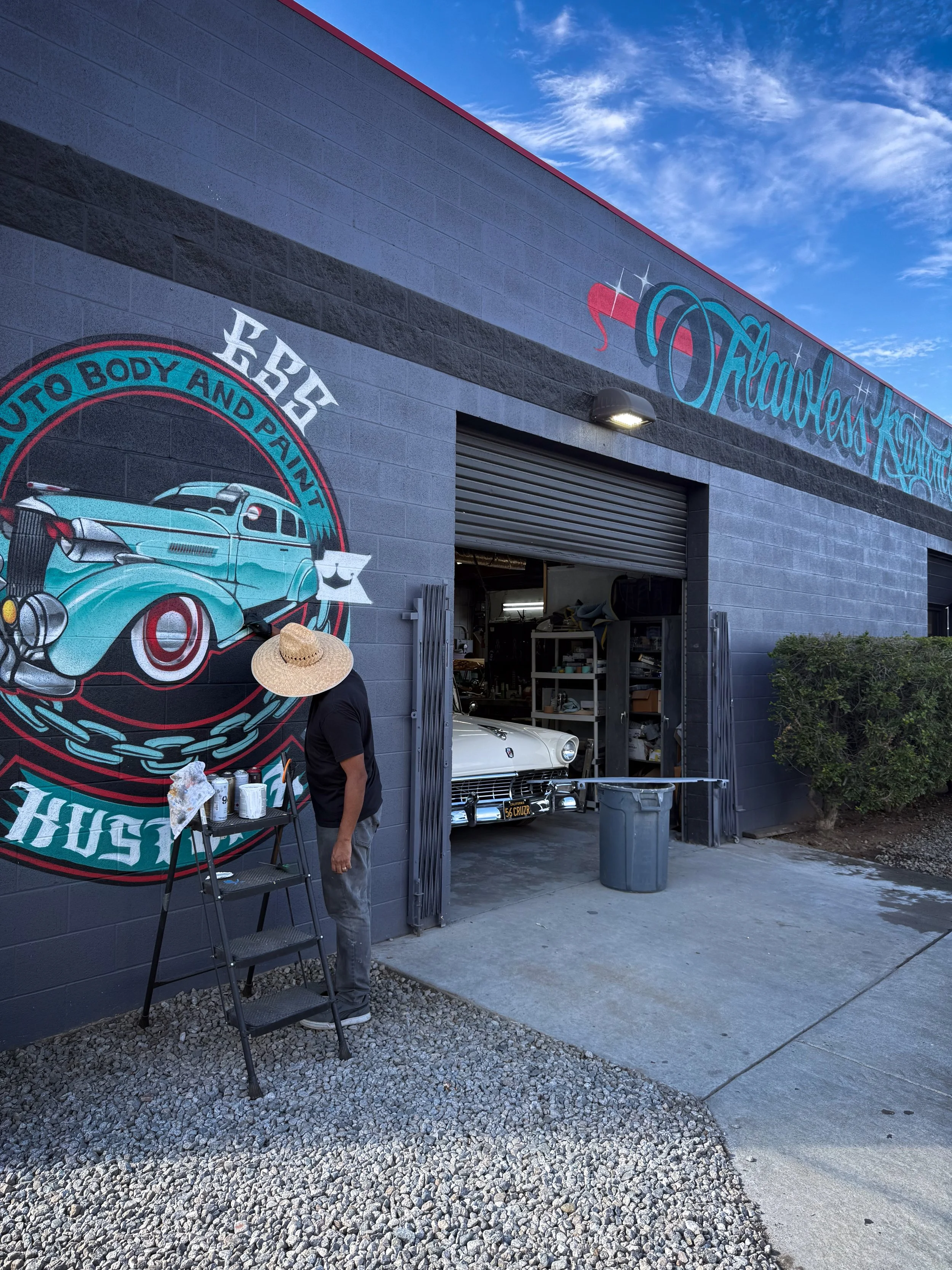 Bold automotive graffiti wall art painted for Flawless Kustoms in Riverside California by mural artist Pezer97 2025