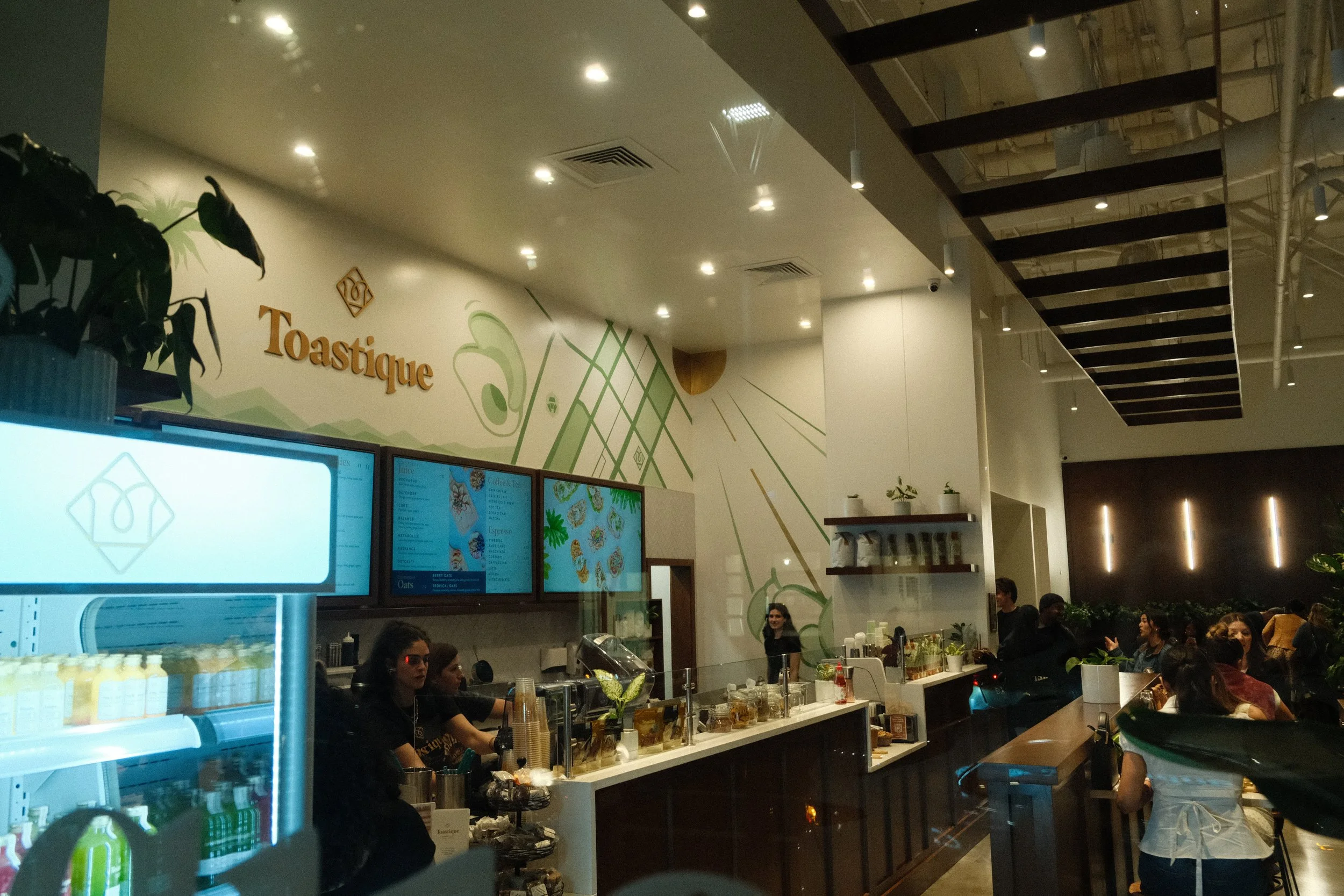 Live mural painting event at Toastique Los Angeles grand opening by mural artist Pezer97