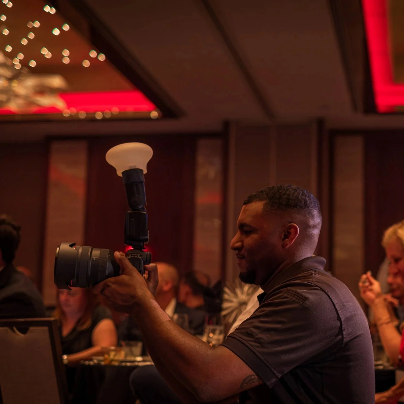 Bryan Nelson, owner of BNelly Photography, photographing an event fundraiser at the Caesar's Republic Hotel in Scottsdale, Arizona.