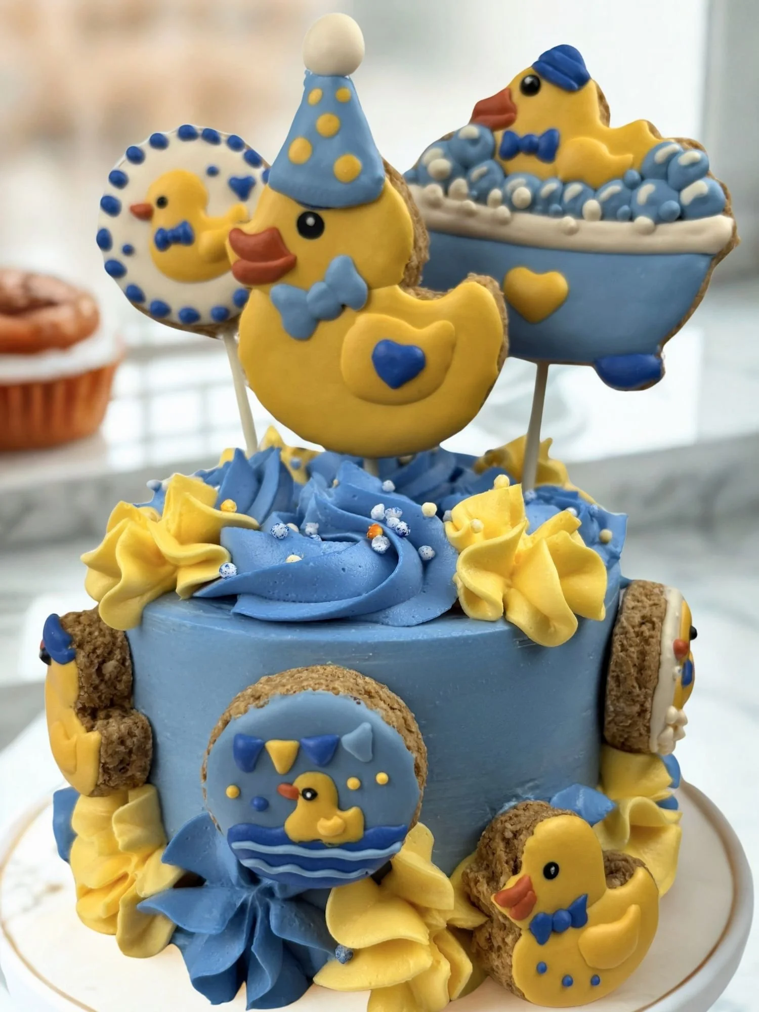 Pooch Kingdom Rubber Duck Dog Birthday Cake with cookies and topper