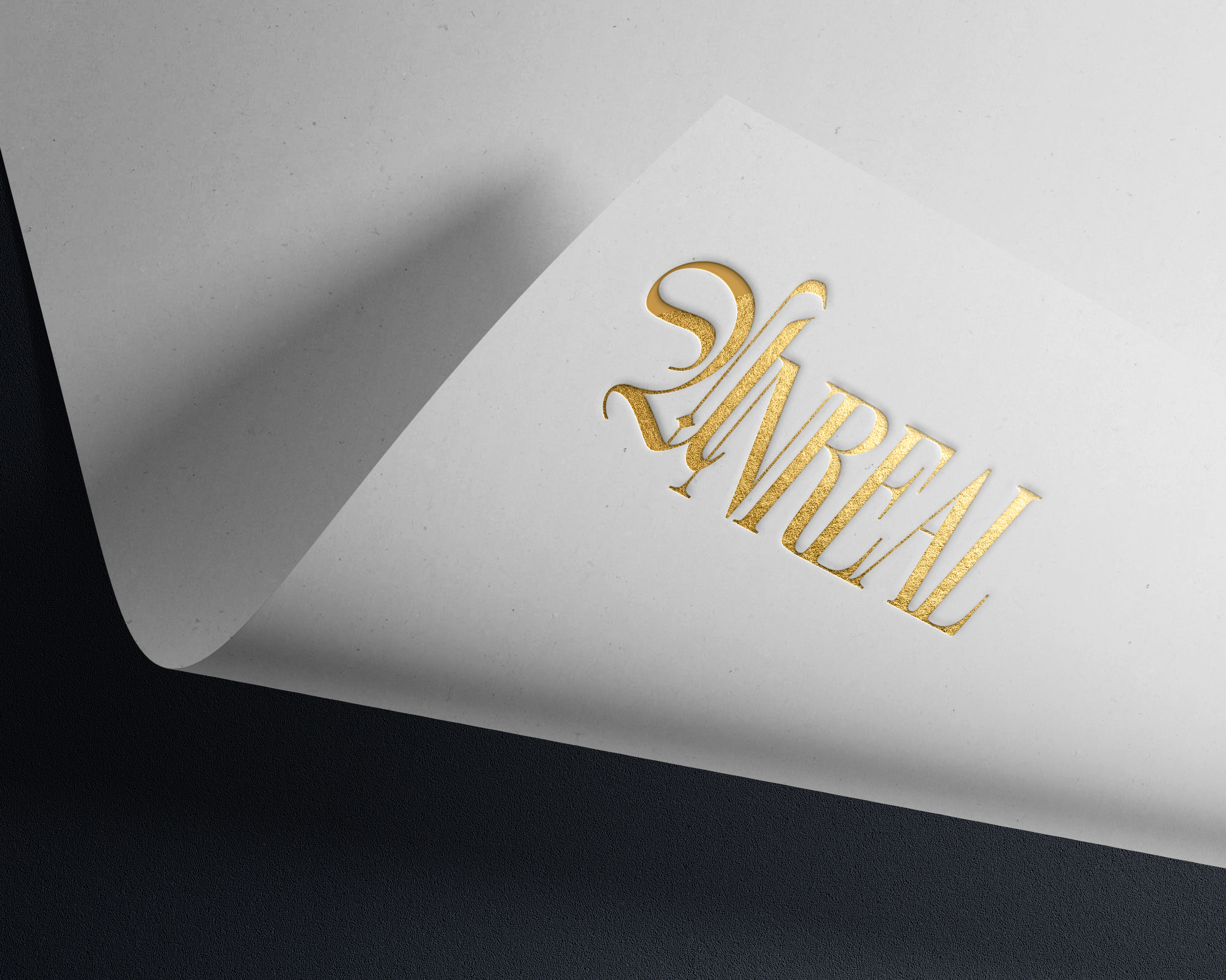 Part of a document or card with gold foil text that reads 'SAB' and a black textured background.