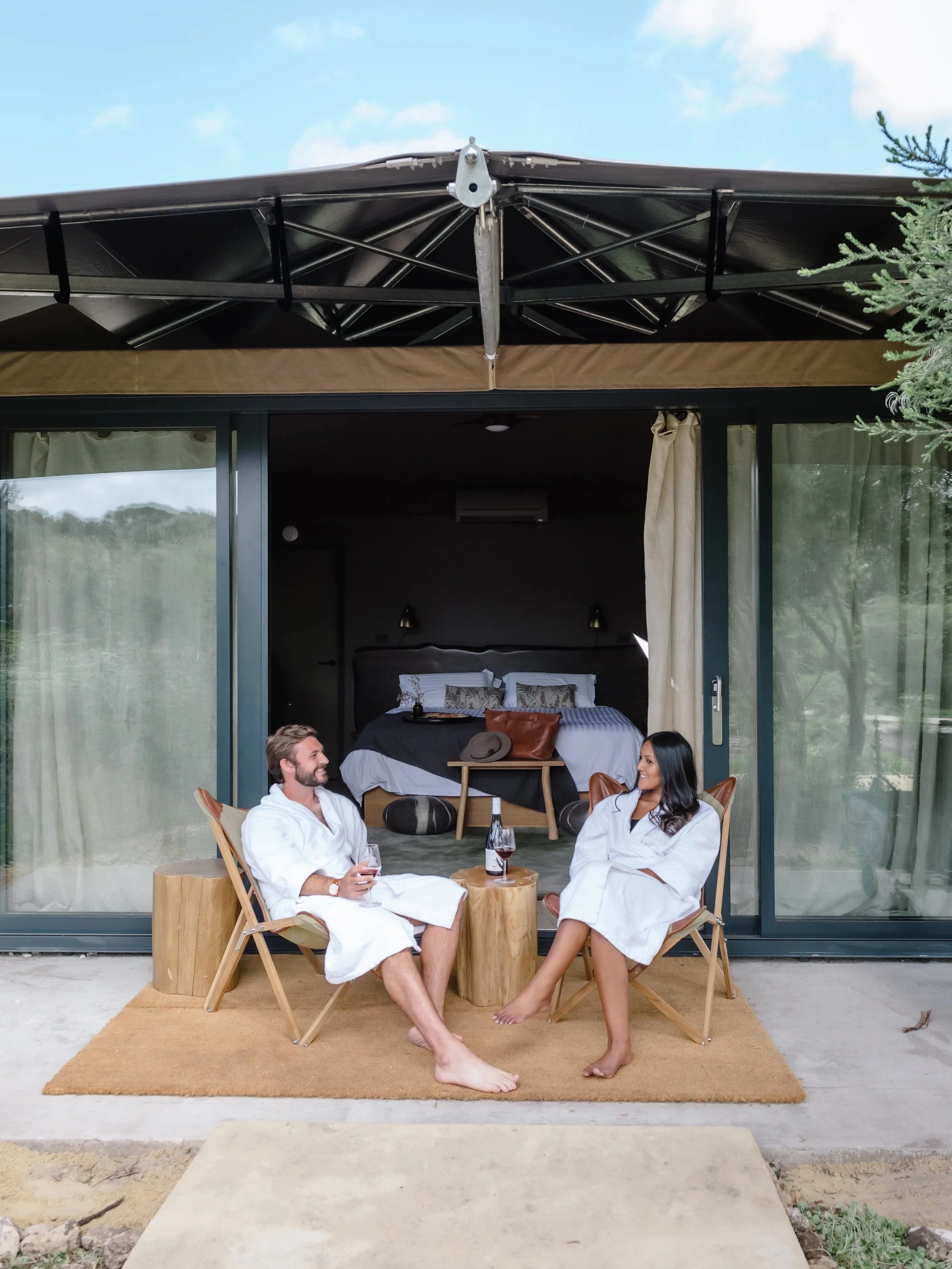 1647910469-glamping-in-front-of-tent.jpg.jpeg
