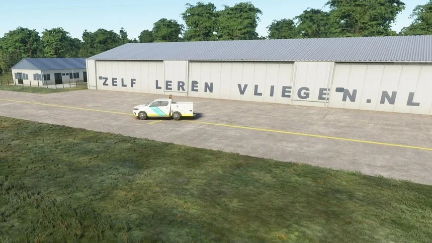 A white vehicle with colorful stripes parked in front of a large white building with large black letters spelling out "Zelf Leren Vliegen NL." The building is situated in an open area with a grassy lawn in the foreground and trees in the background.