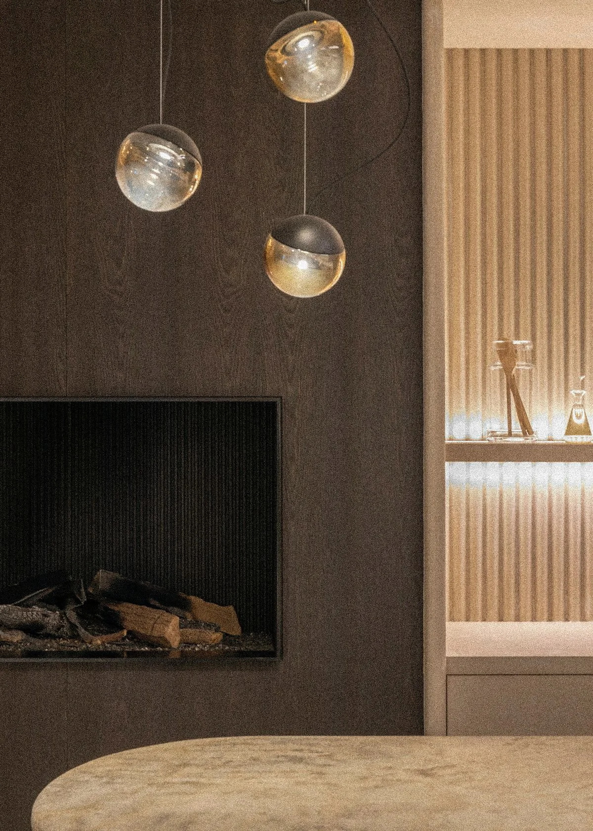 Modern living space with three spherical pendant lights hanging from the ceiling, a built-in fireplace with logs, and a beige or light wood wall paneling.Residential interior design project in Scotland - Interior Designer Scotland - Interiors 