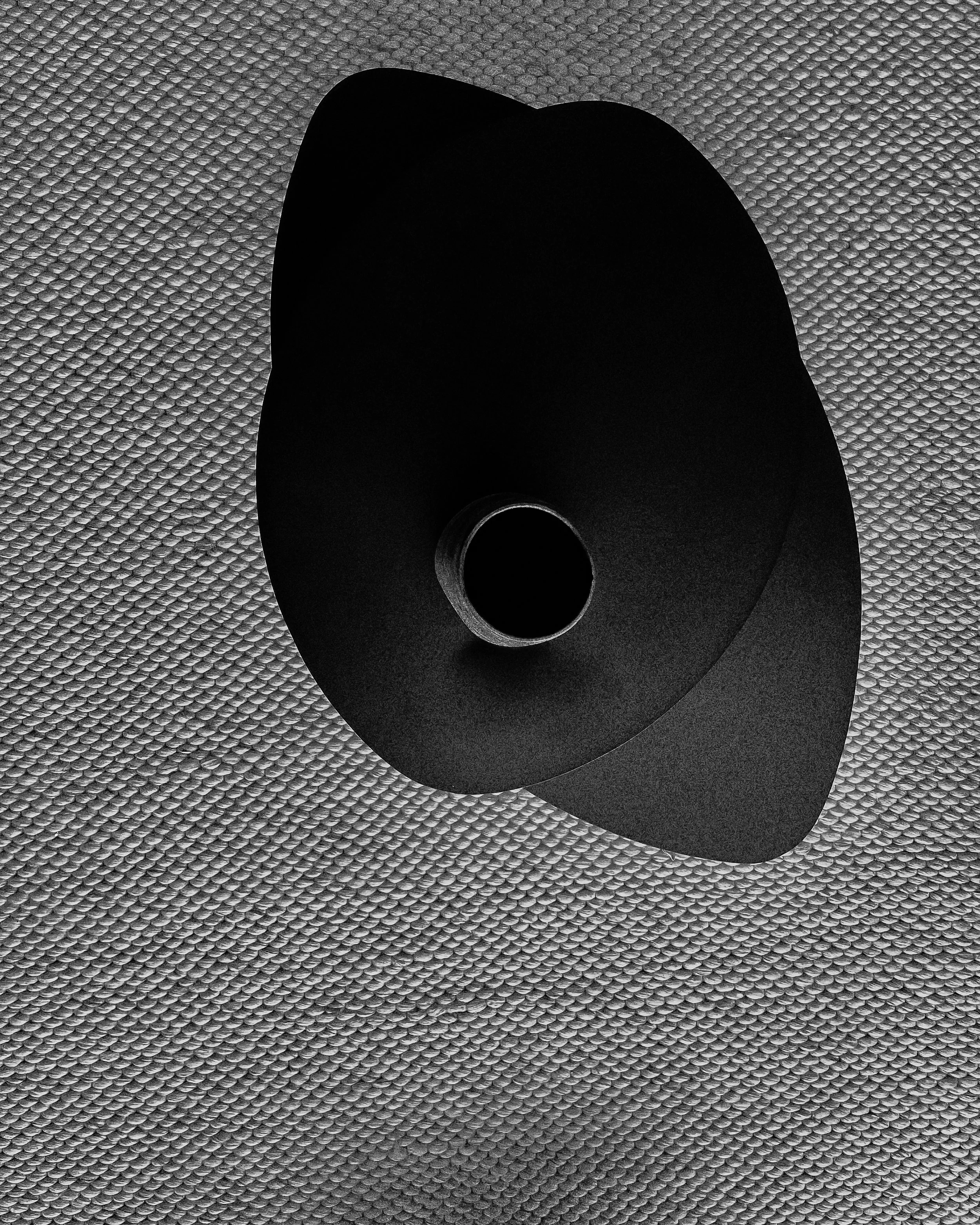 A black cone-shaped speaker placed on a textured gray surface.“Residential interior design project in Scotland by [Studio Name], working across Glasgow, Edinburgh, Dundee and the Highlands.”

“Contemporary Scottish interior design by [Studio Name], s