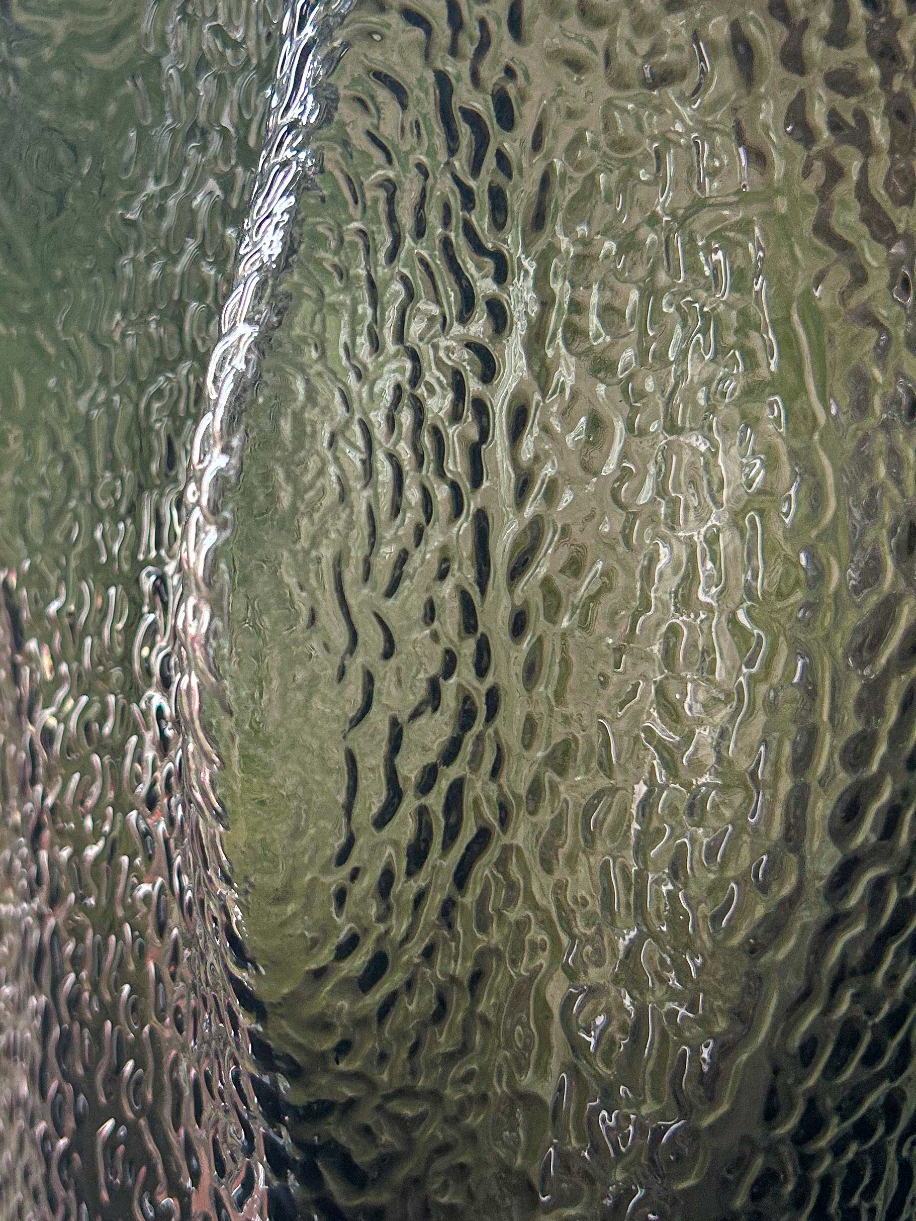 Close-up of water droplets on glass, creating a textured, distorted view of the outside scenery.Residential interior design project in Scotland - Interior Designer Scotland - Interiors 