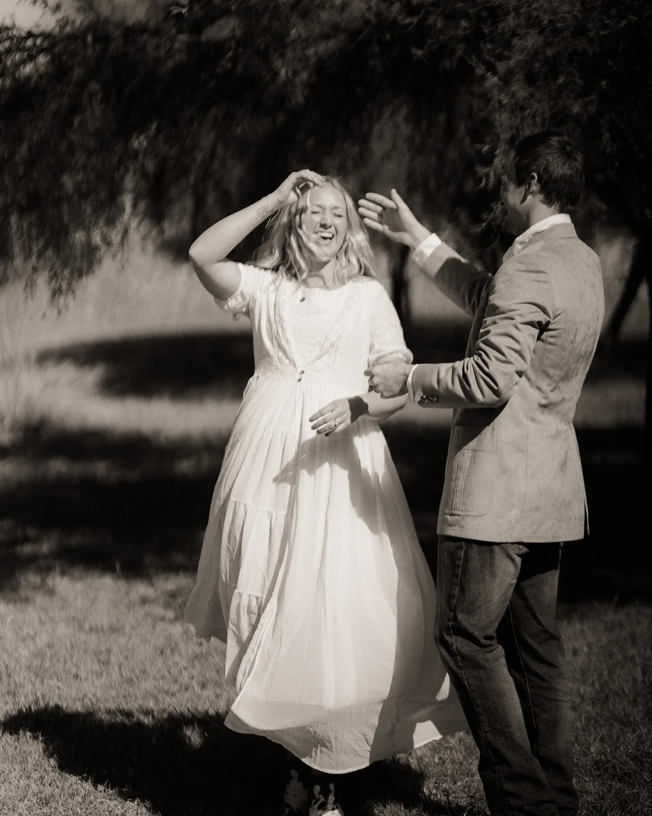  Nikki laughing while dancing with Sawyer after their private ceremony 