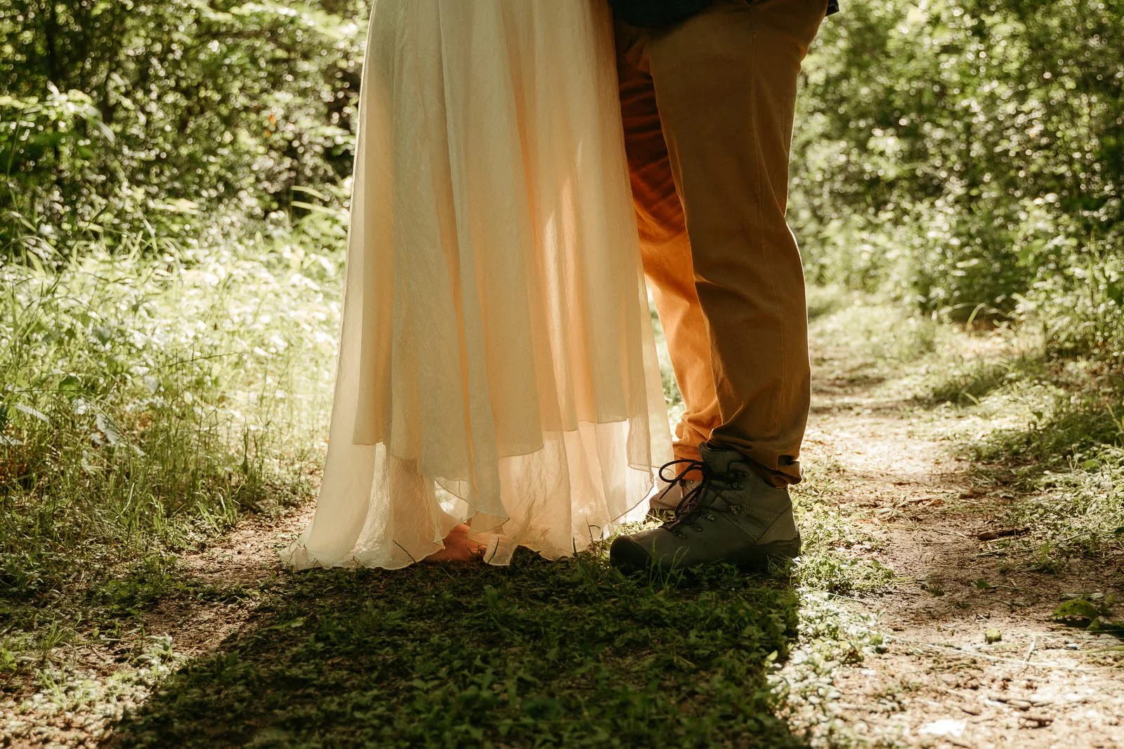 Dan and Carolyn's feet in the mossy grass during their ceremony