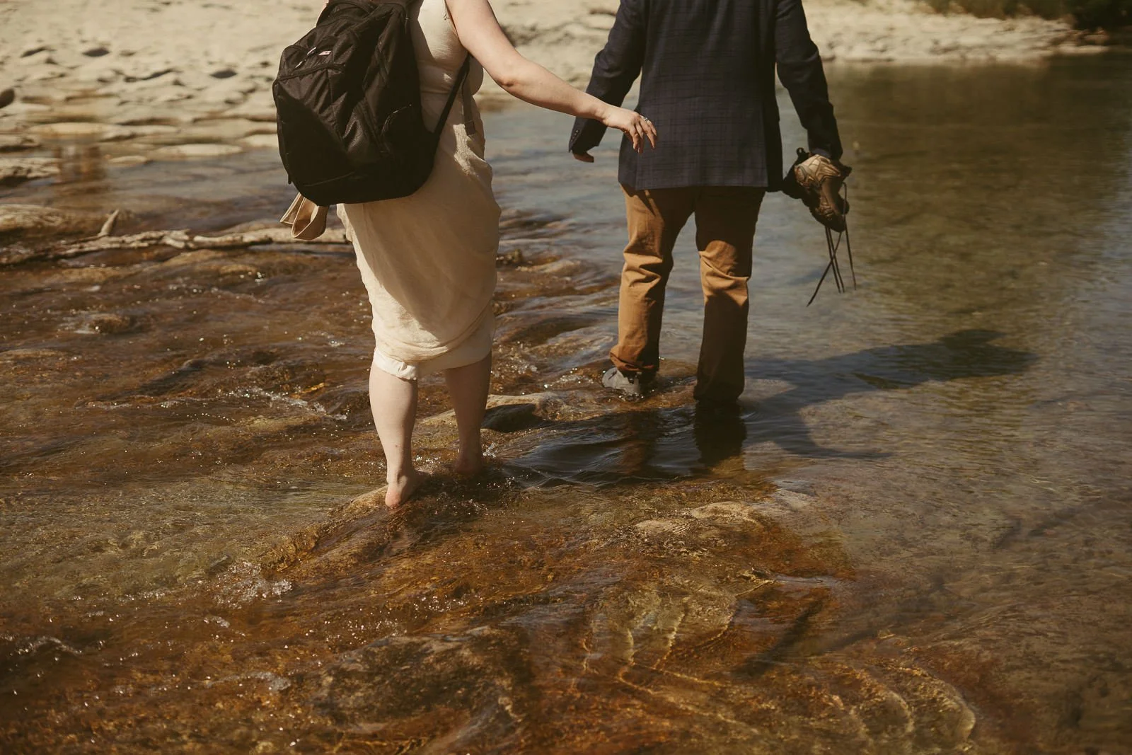 Dan and Carolyn wading through a shallow part of Onion Creek