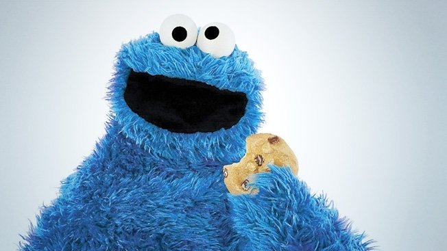 Furry blue character resisting temptation with a cookie, symbolizing diet discipline over the weekend