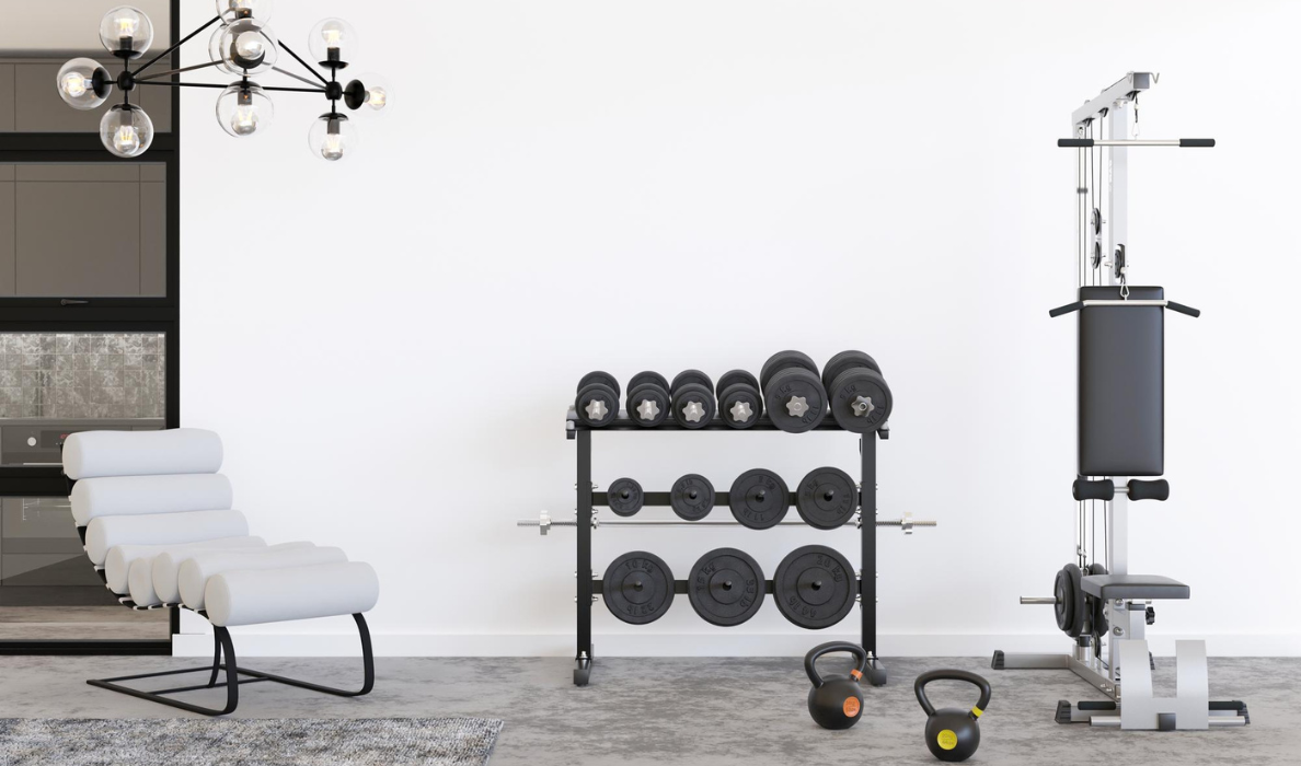 Luxury home gym with dumbbell rack, kettlebells and cable machine in a modern Barcelona residence