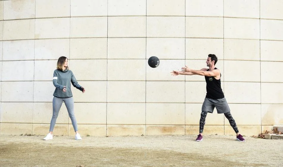 Outdoor group training session with a medicine ball in Barcelona