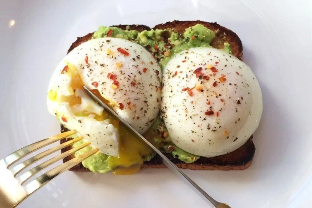 Poached eggs and avocado on wholegrain toast