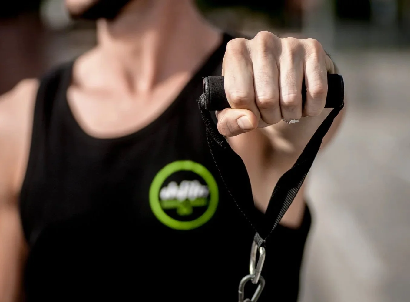 TRX suspension training during home personal training session in Eixample, Barcelona