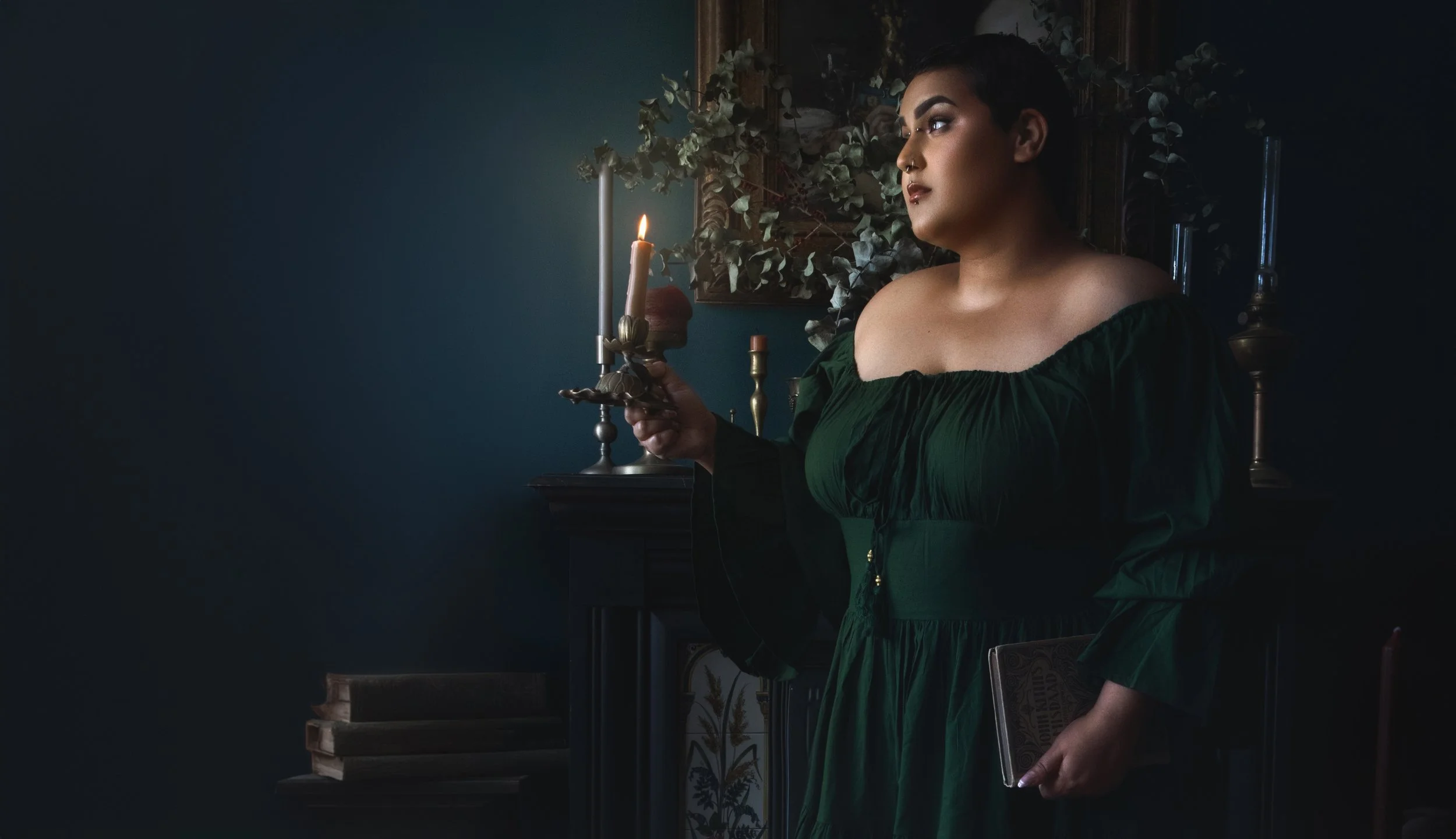 Dreamy fine art portrait of Neesha with rich green and crimson tones, inspired by folklore and classical paintings. Romantic, painterly fantasy photography featuring flowers, water and soft candlelight. Emotional storytelling imagery in a fine art st