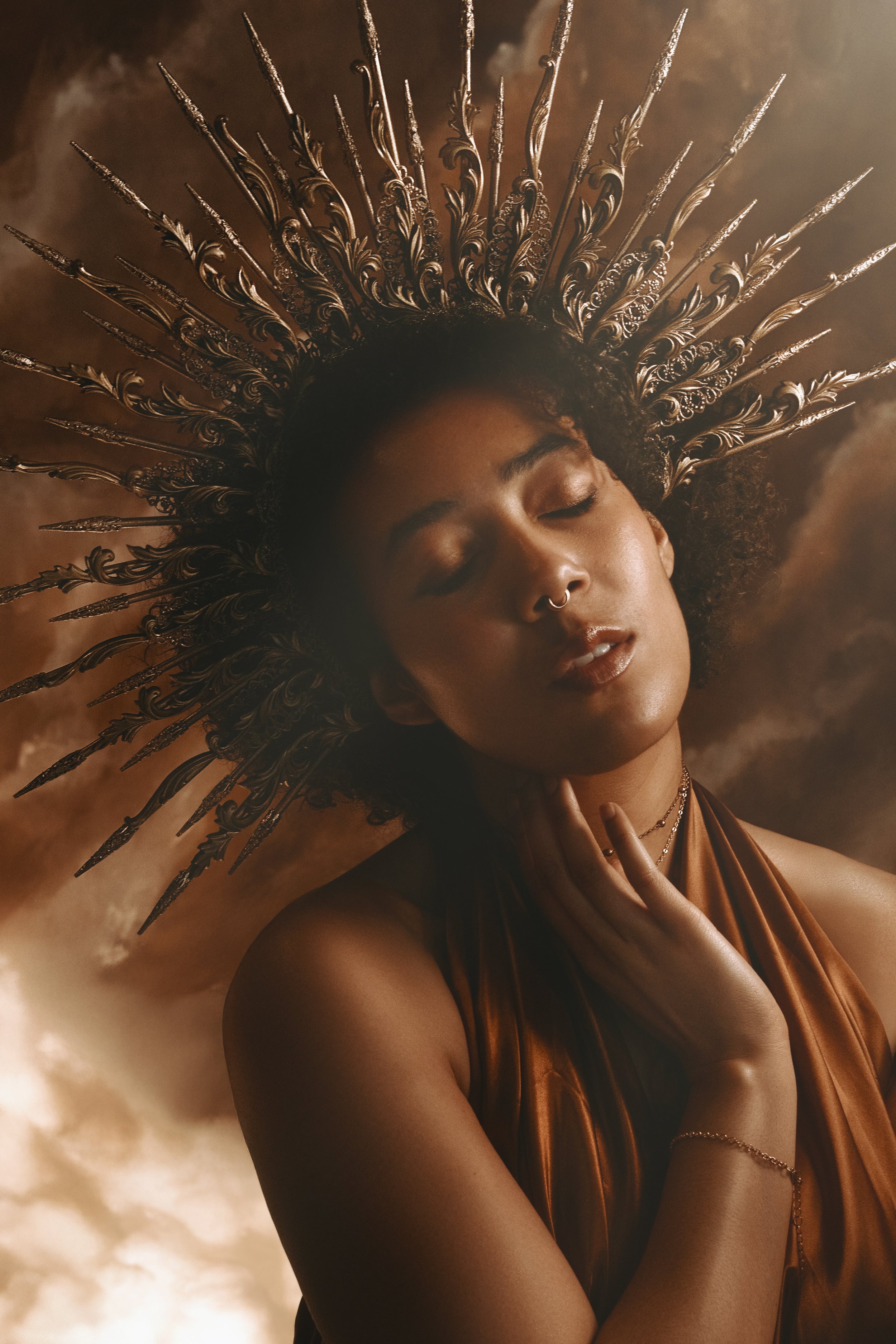 Fine art fantasy portrait of sun and moon goddesses with celestial crowns, clouds and dramatic light. Mythology inspired photography with golden and silver tones, painterly style and dreamy storytelling atmosphere.