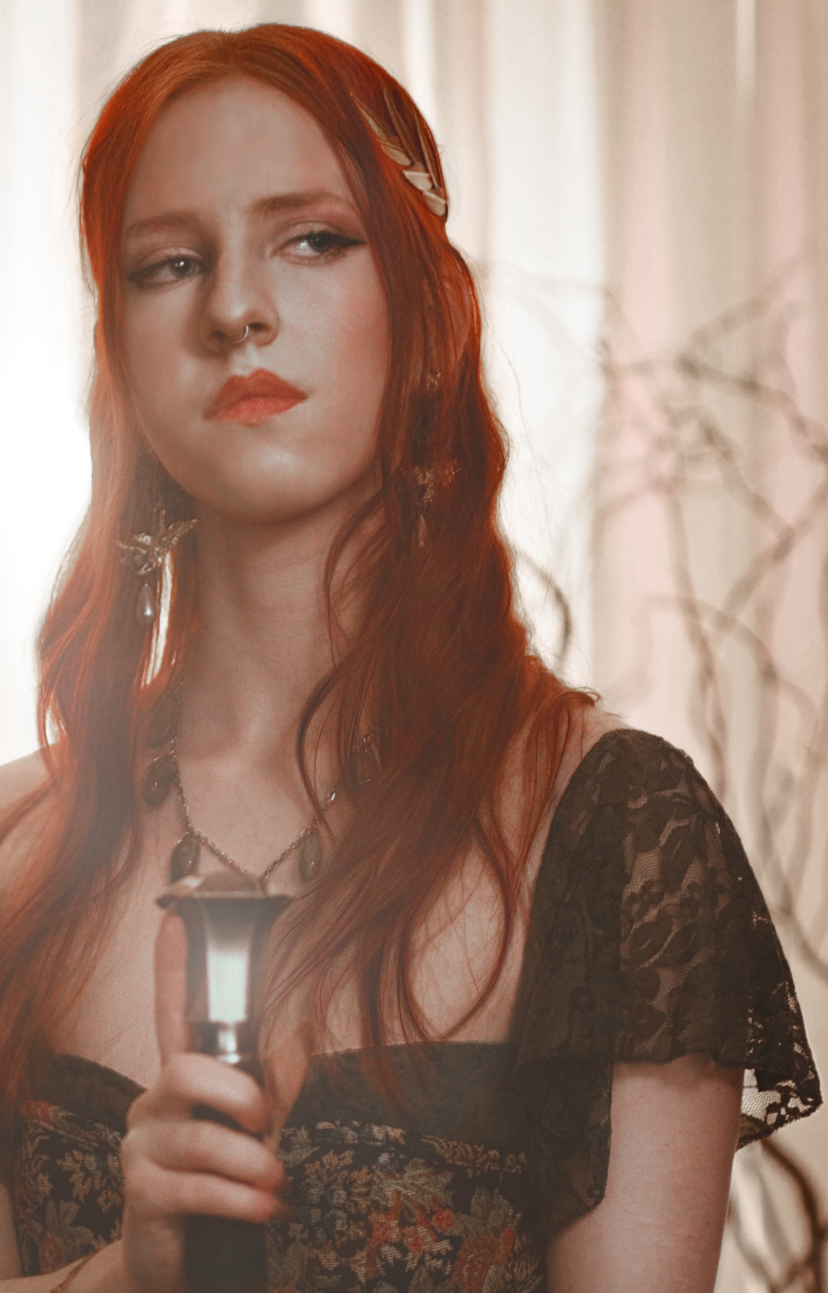 Dark fantasy cosplay portrait with candlelight, jewelry and romantic styling. Fine art photography inspired by gothic romance, historical fashion and storytelling. Moody, painterly imagery with rich textures and soft dramatic light.