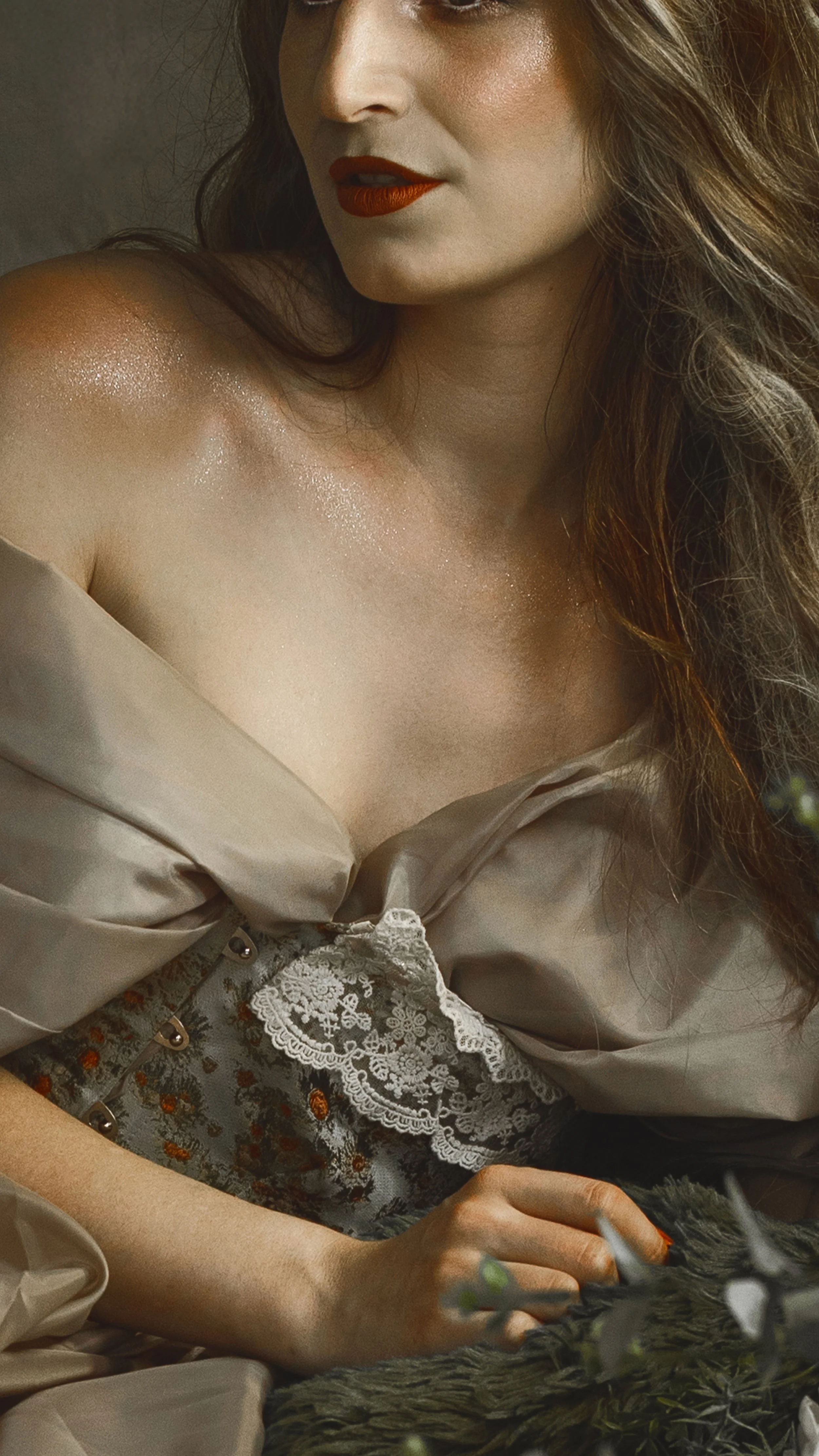 Dreamy fine art portrait of a woman in water surrounded by flowers and soft reflections. Painterly fantasy photography inspired by folklore, mythology and classical paintings. Romantic, ethereal imagery with storytelling atmosphere and natural elemen