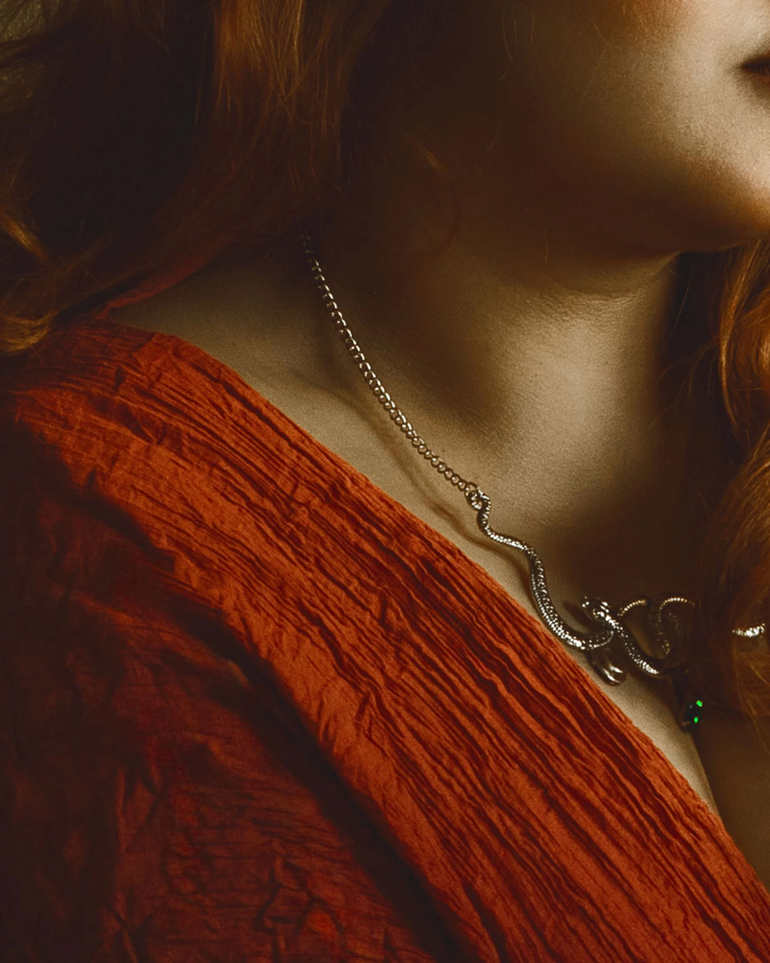 Dreamy fine art portrait of a woman in water surrounded by flowers and soft reflections. Painterly fantasy photography inspired by folklore, mythology and classical paintings. Romantic, ethereal imagery with storytelling atmosphere and natural elemen