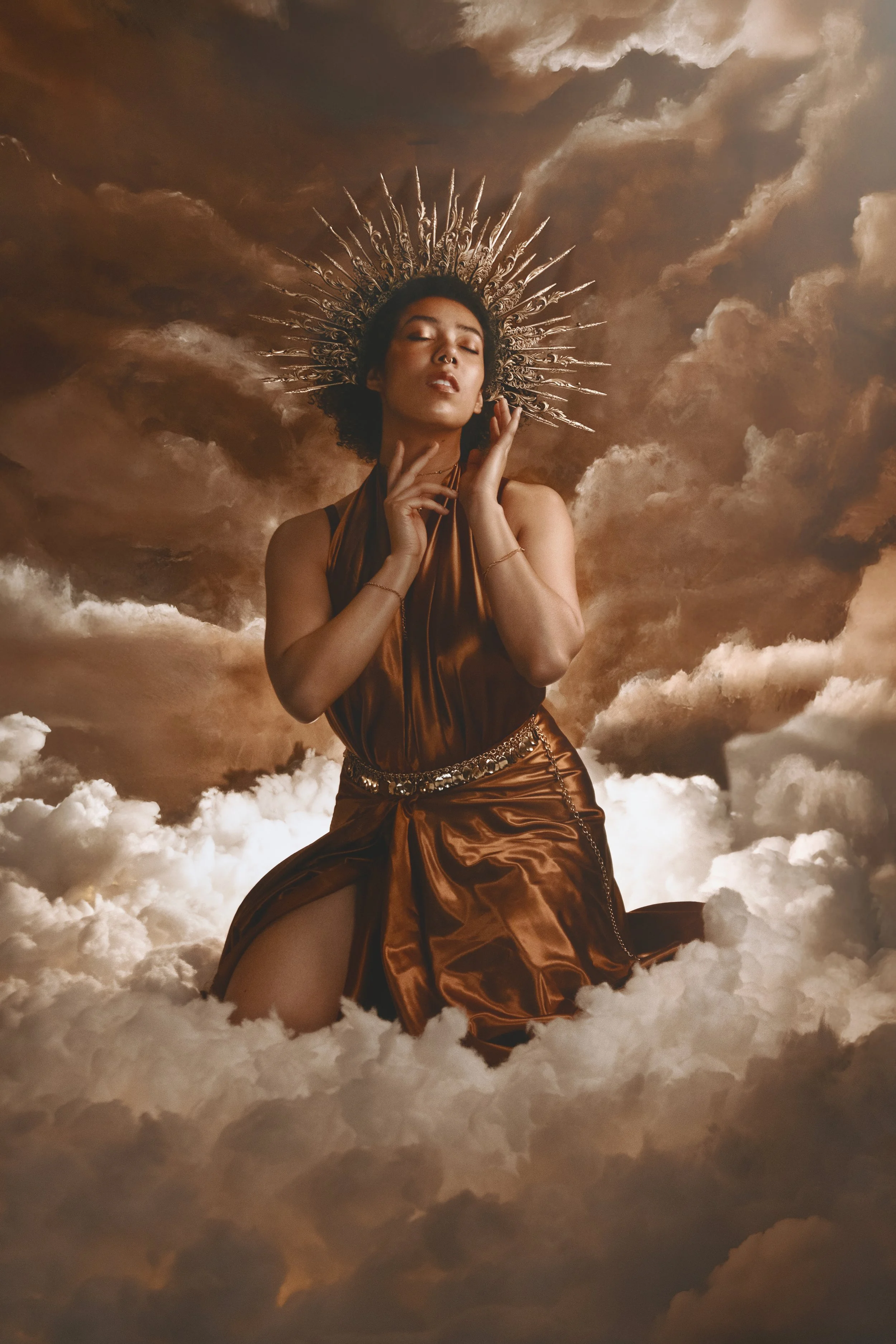 Fine art fantasy portrait of sun and moon goddesses with celestial crowns, clouds and dramatic light. Mythology inspired photography with golden and silver tones, painterly style and dreamy storytelling atmosphere.