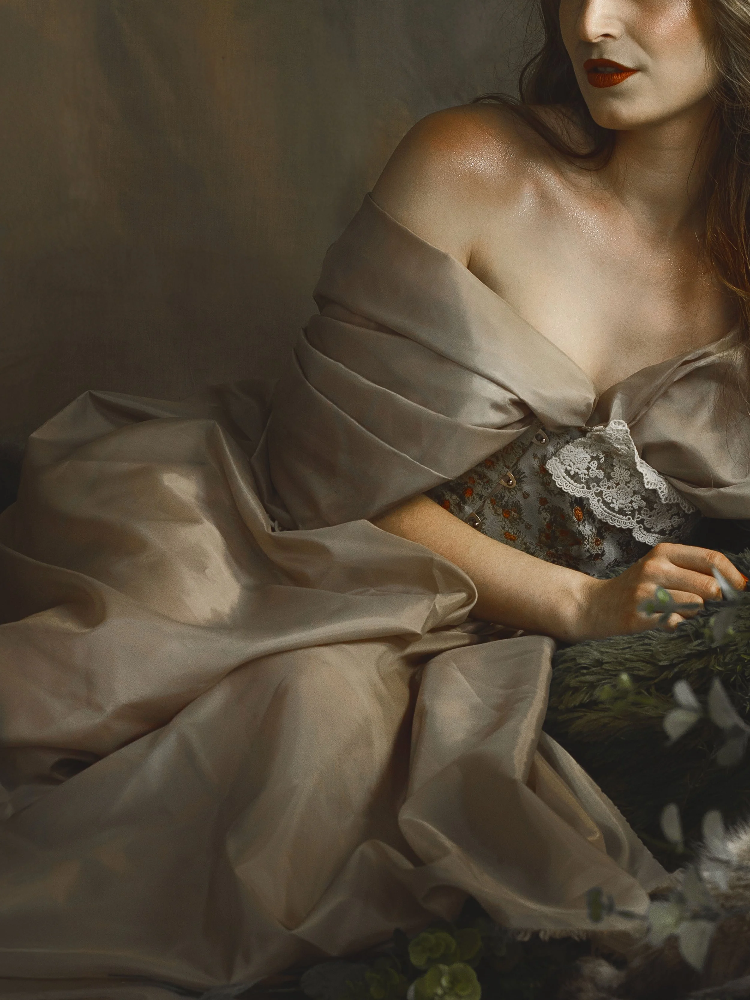 Dreamy fine art portrait of a woman in water surrounded by flowers and soft reflections. Painterly fantasy photography inspired by folklore, mythology and classical paintings. Romantic, ethereal imagery with storytelling atmosphere and natural elemen