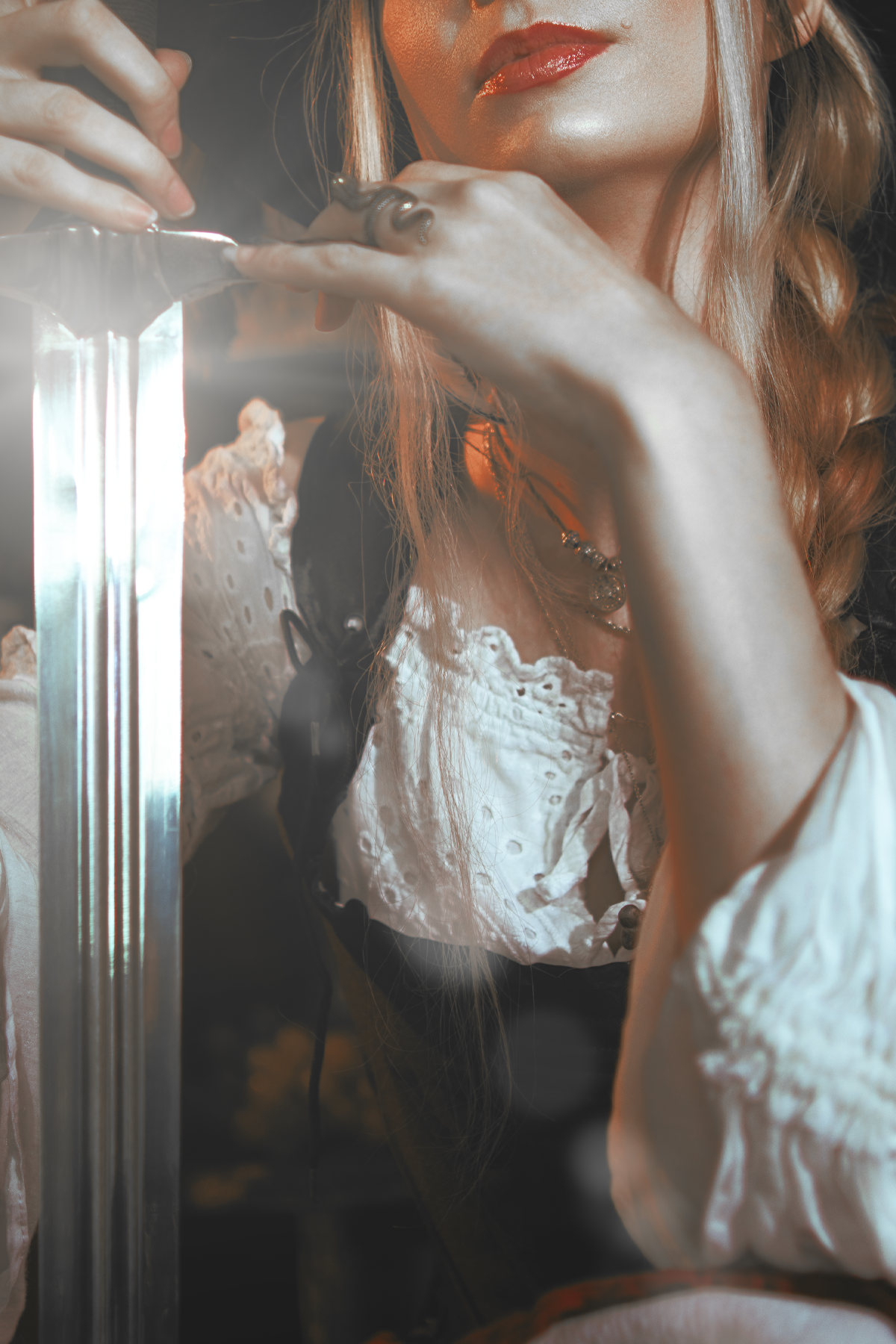 Pirate inspired cosplay portrait with sword and historical styling. Fine art fantasy photography influenced by seafaring adventures and vintage aesthetics, featuring warm light and a cinematic storytelling atmosphere.