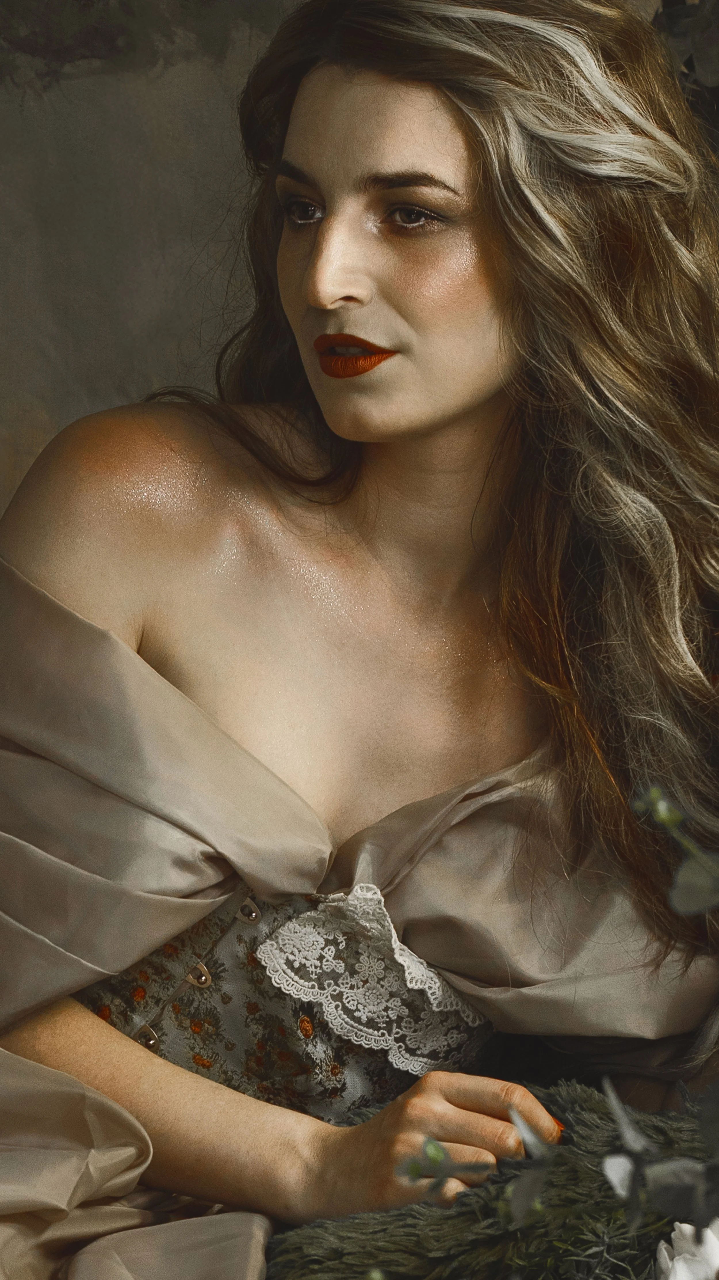 Dreamy fine art portrait of a woman in water surrounded by flowers and soft reflections. Painterly fantasy photography inspired by folklore, mythology and classical paintings. Romantic, ethereal imagery with storytelling atmosphere and natural elemen