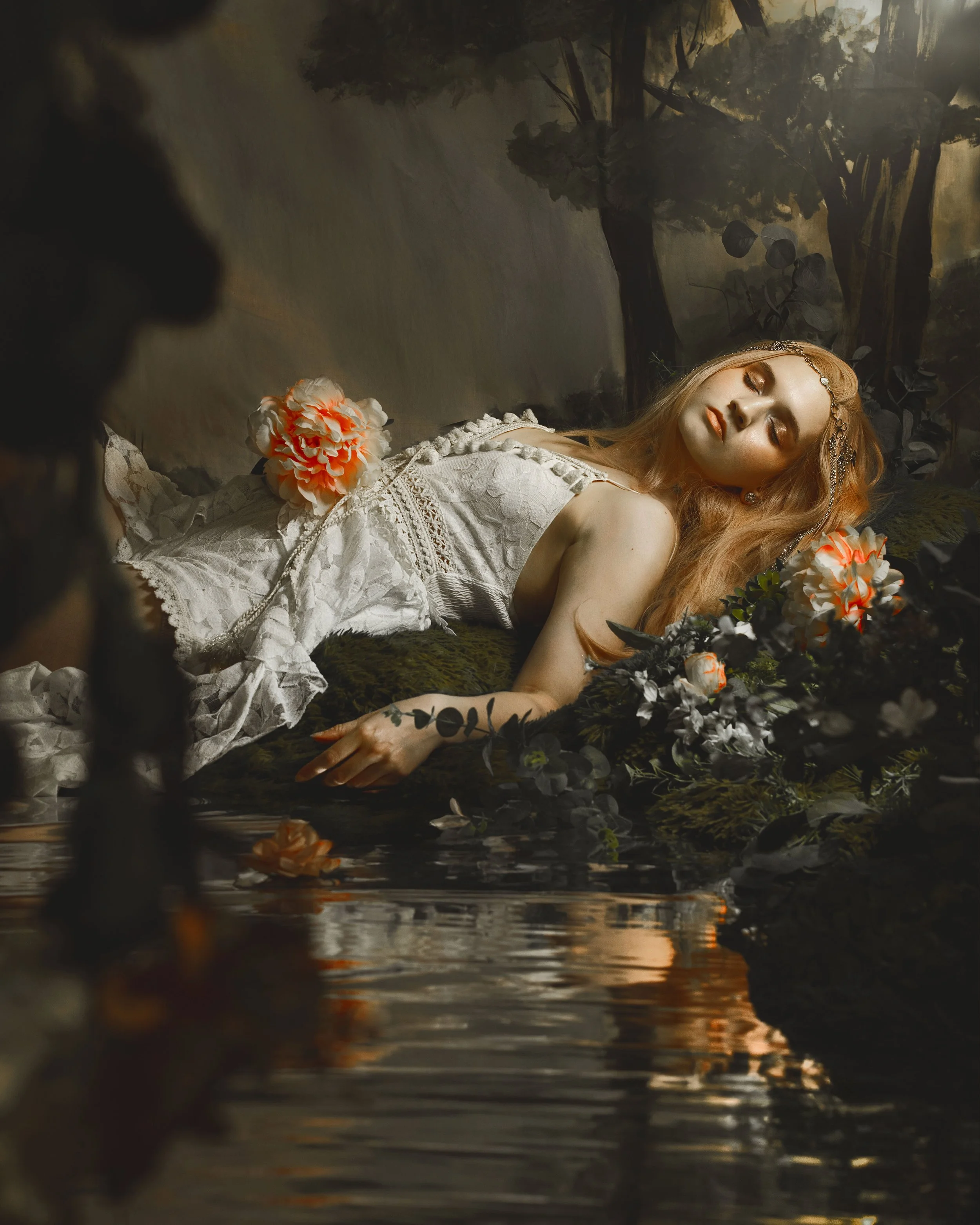 Dreamy fine art portrait of a woman in water surrounded by flowers and soft reflections. Painterly fantasy photography inspired by folklore, mythology and classical paintings. Romantic, ethereal imagery with storytelling atmosphere and natural elemen