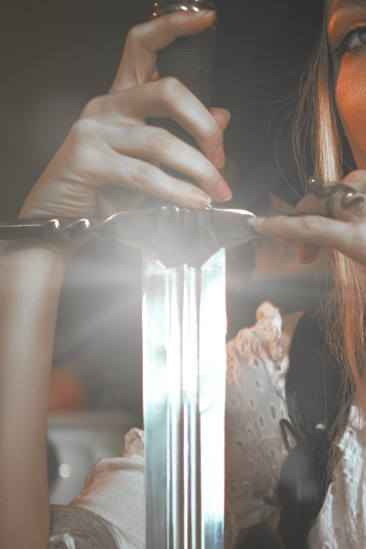 Pirate inspired cosplay portrait with sword and historical styling. Fine art fantasy photography influenced by seafaring adventures and vintage aesthetics, featuring warm light and a cinematic storytelling atmosphere.