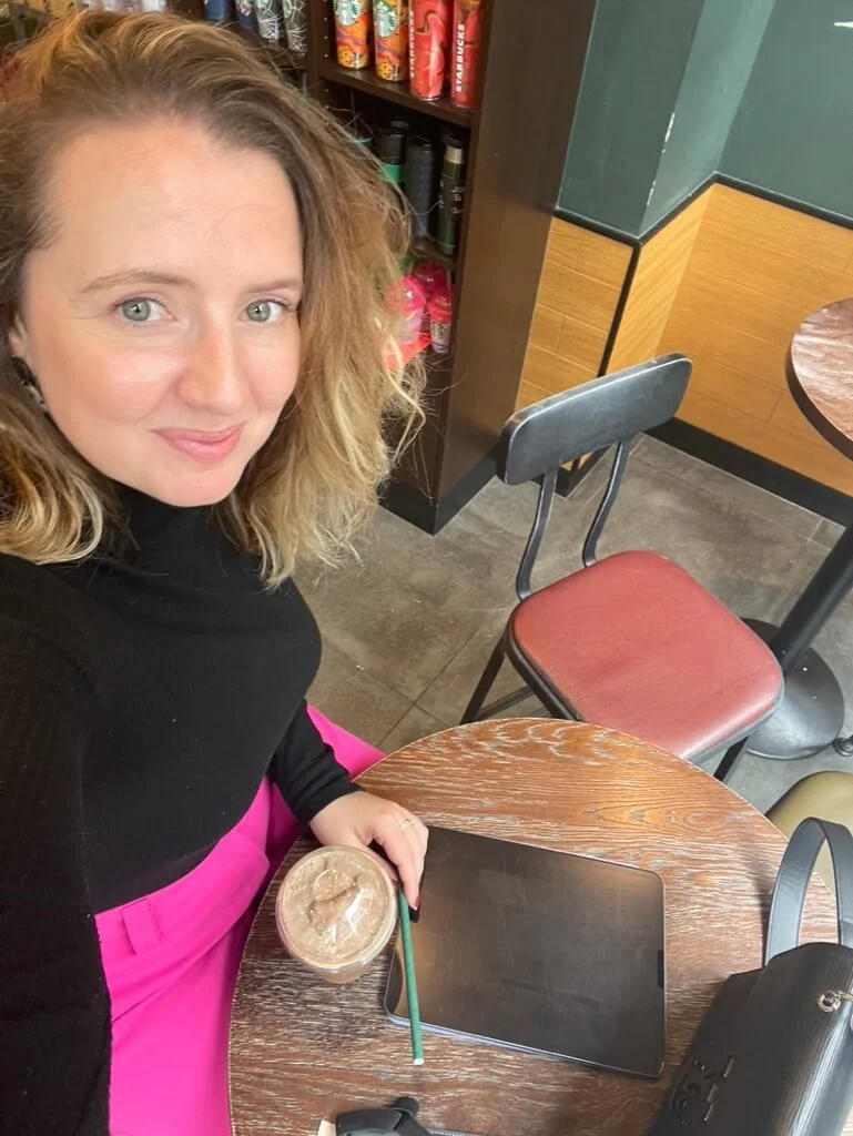Selfie of Insurance career coach Sandra working at a coffee shop