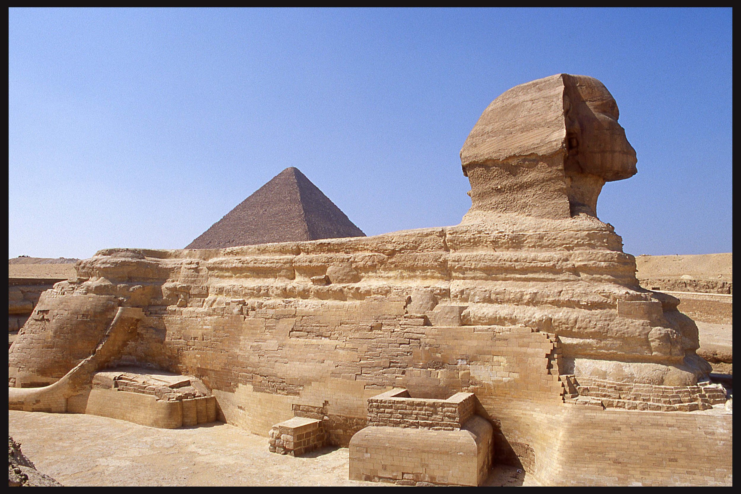 Sphinx and Cheops, Giza, Egypt.