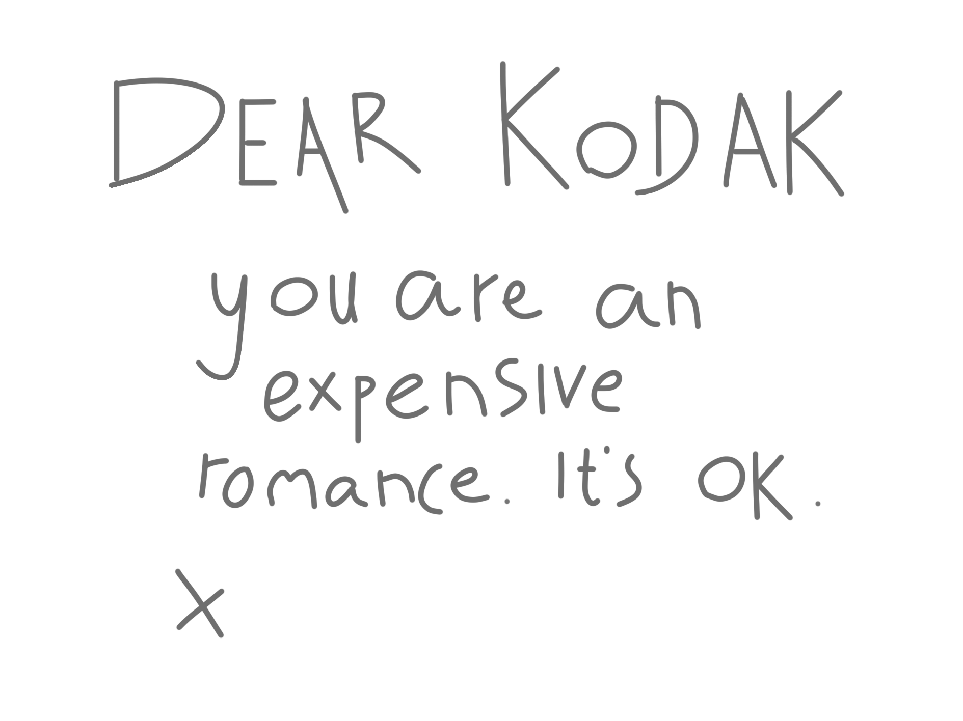 A black background with white handwritten text saying, 'Dear Kodak, you are an expensive romance. It's ok.'