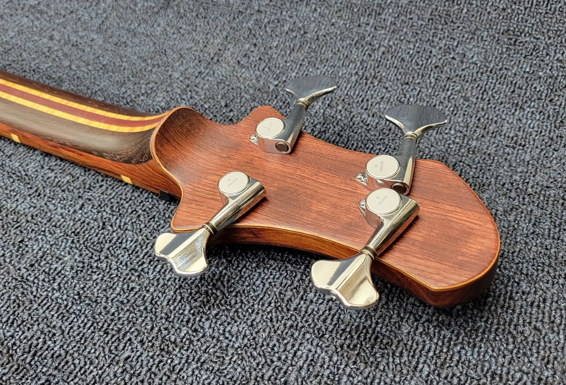 multi-lam red head overlay and Gotoh GB-707 tuners in chrome