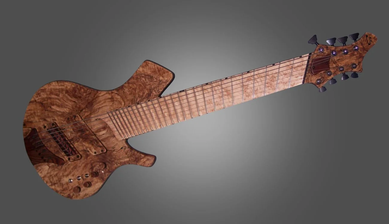 A custom-made electric guitar with a natural wood finish, featuring a unique grain pattern and black tuning pegs.