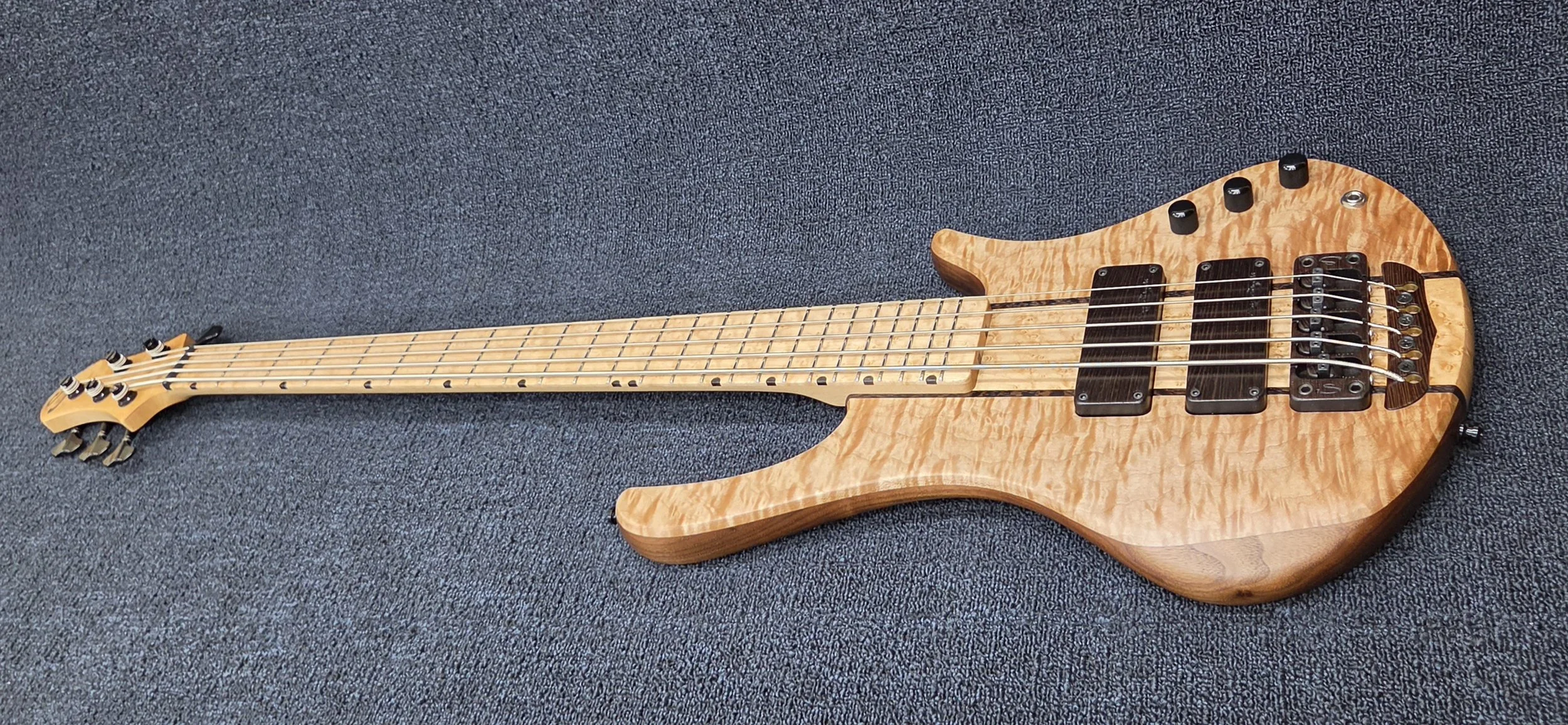 Simonetti bolt-on 5 string bass in the Artisan body design with Quilted Maple top and Birdseye Maple fingerboard