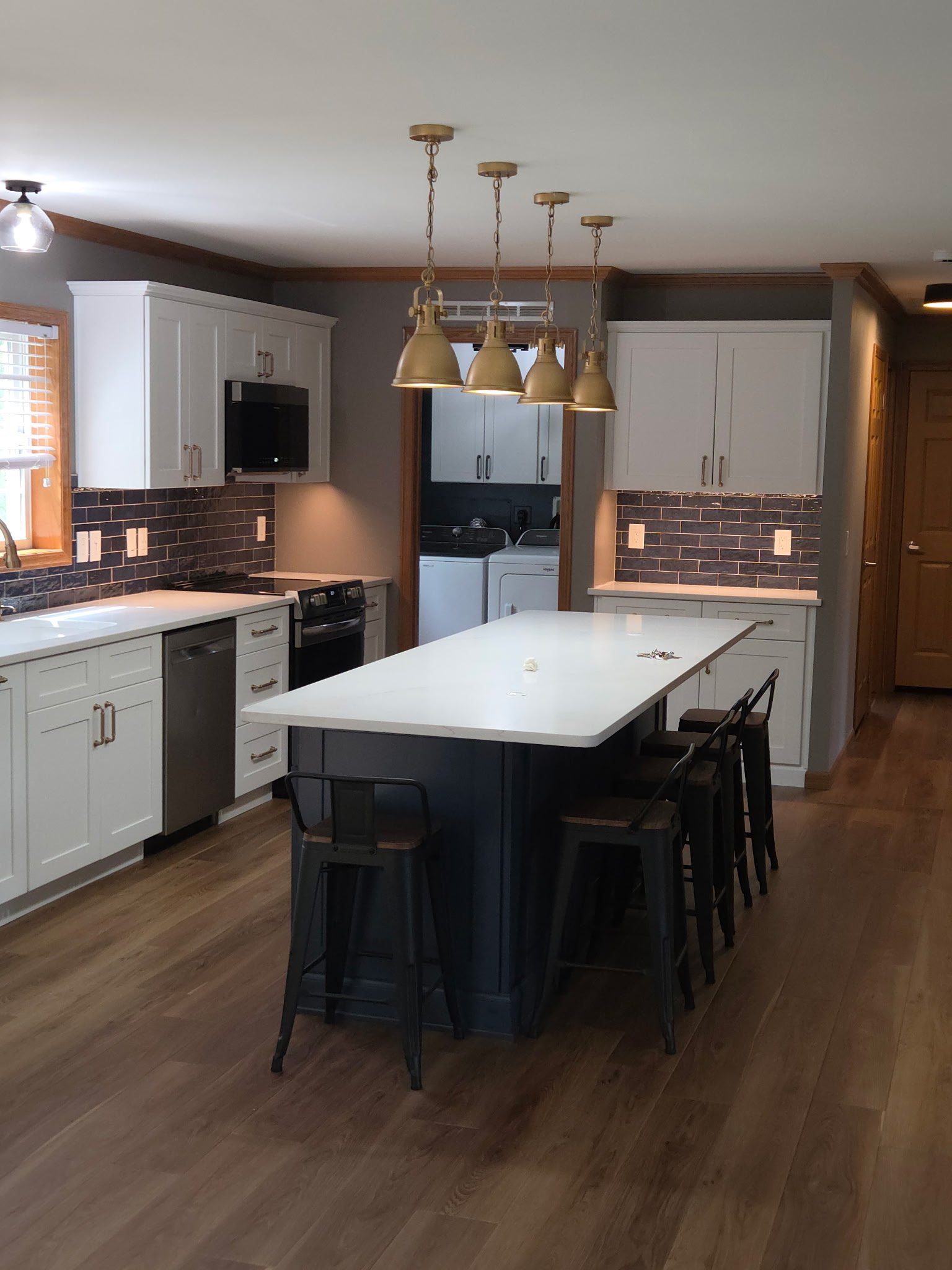 First Floor Remodel - Spring 2025 - Ocean Blue and White cabinetry, Shaw LVP flooring, MSI Quartz, Tile backsplash, Delta Touch Faucet