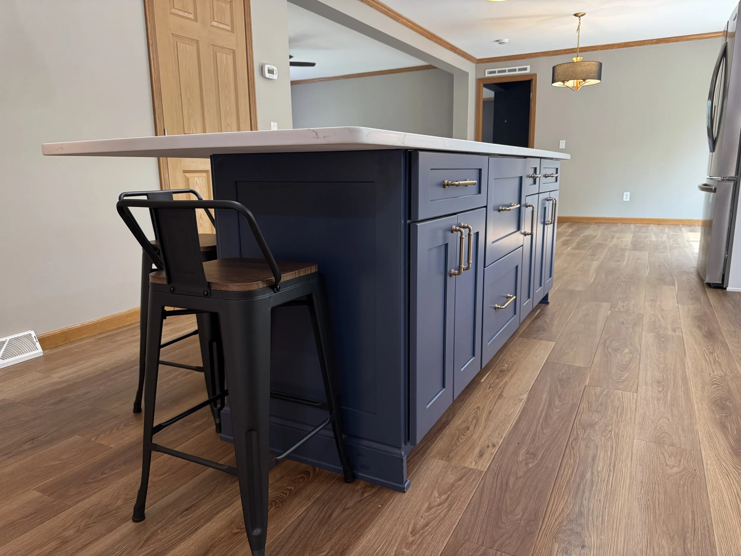 First Floor Remodel - Spring 2025 - Ocean Blue and White cabinetry, Shaw LVP flooring, MSI Quartz, Tile backsplash, Delta Touch Faucet