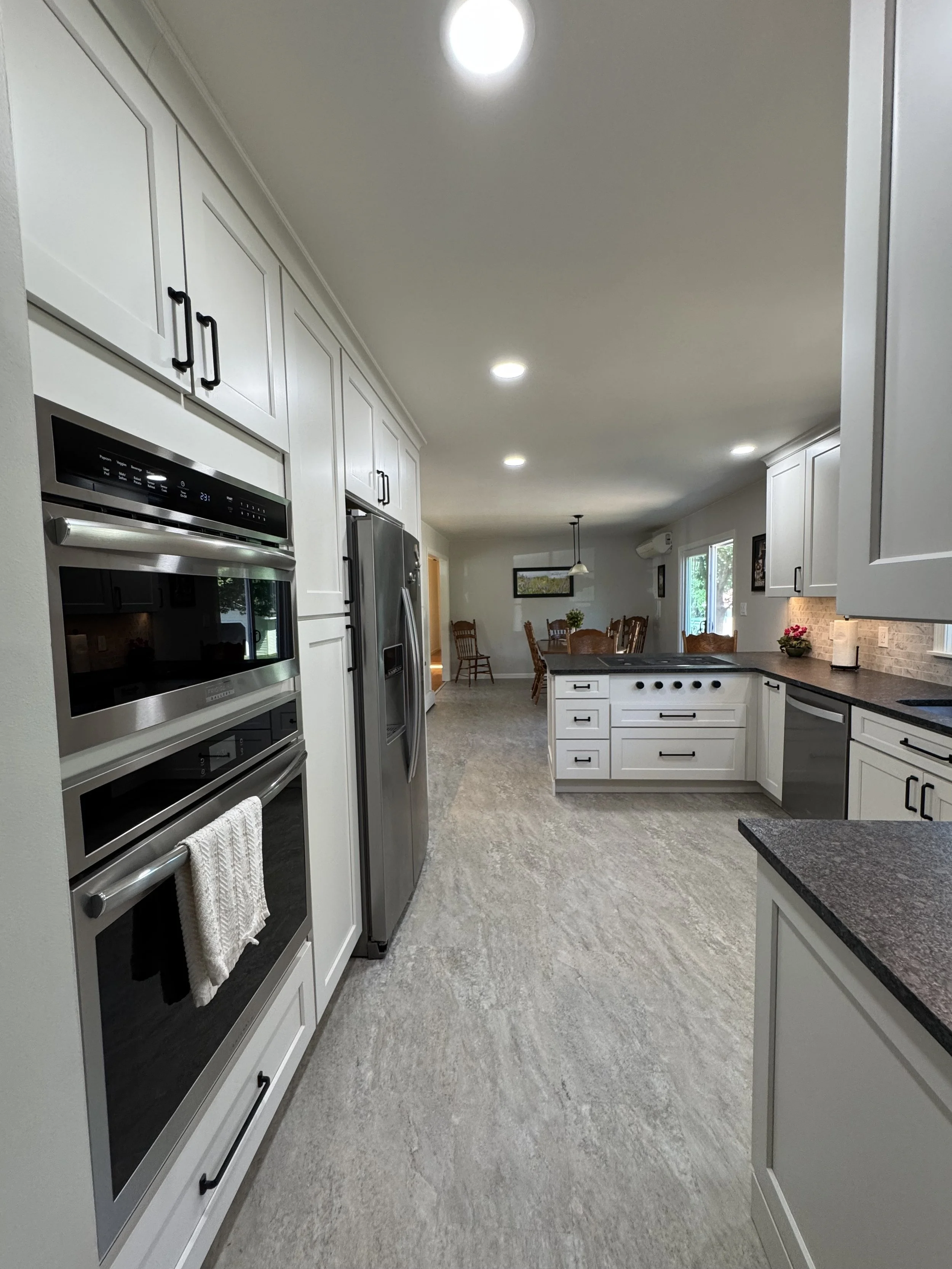 Kitchen Remodel - Spring 2025 - Legend Cabinetry, Steel Grey honed Granite, Provenza LVT flooring, Tile backsplash 