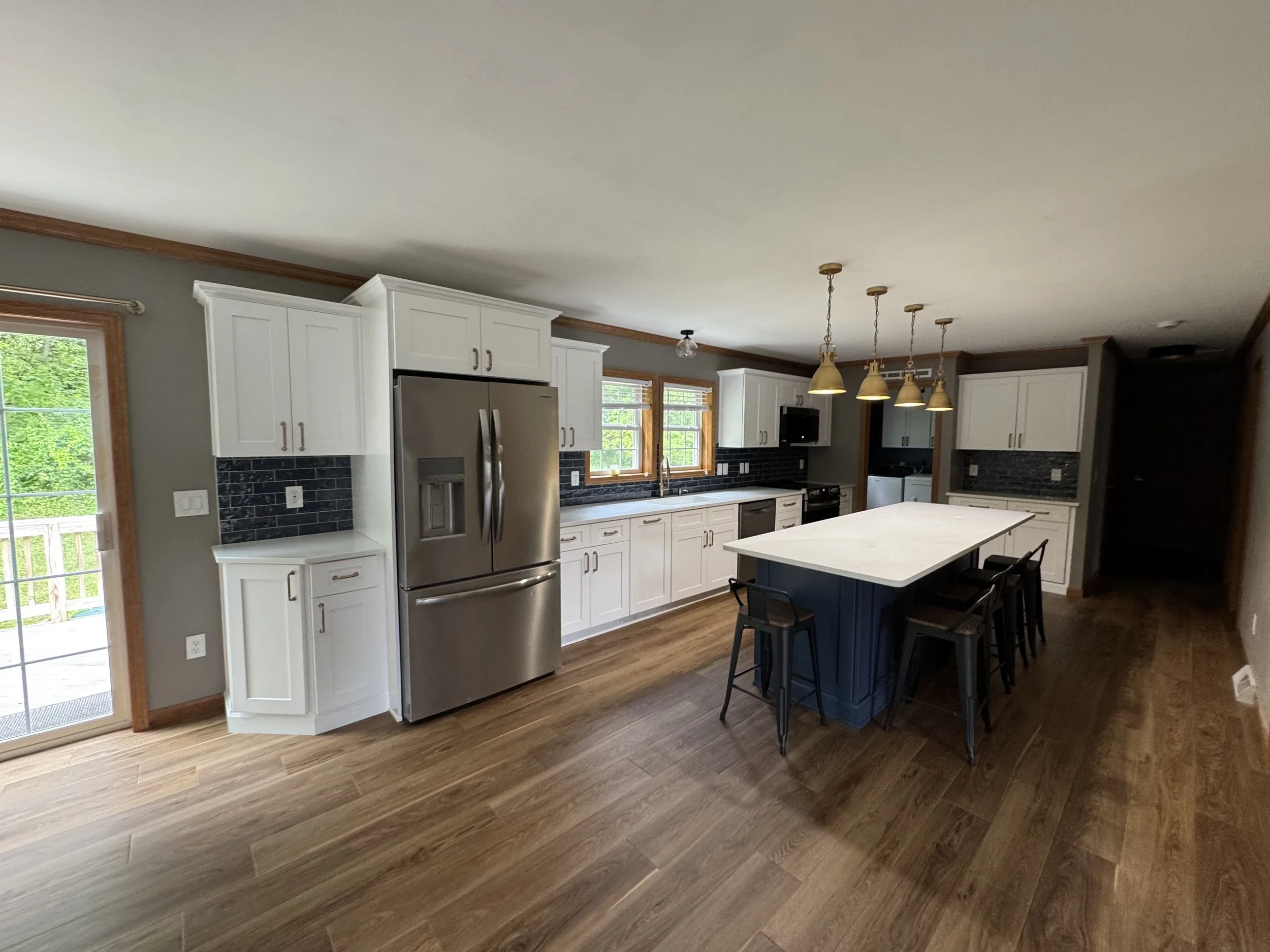 First Floor Remodel - Spring 2025 - Ocean Blue and White cabinetry, Shaw LVP flooring, MSI Quartz, Tile backsplash, Delta Touch Faucet 